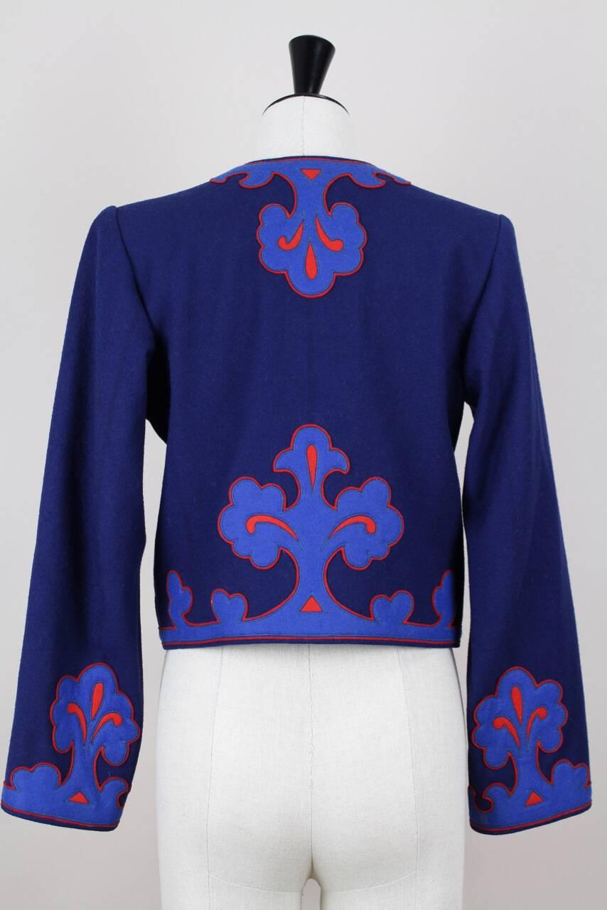 Autumn/Winter 1978 documented (see last picture) YSL SAINT LAURENT Rive Gauche royal blue cropped bolero style wool jacket with fabulous floral appliqués in lapis lazuli blue and bright red. Open front, long sleeves and fully lined. Labeled 