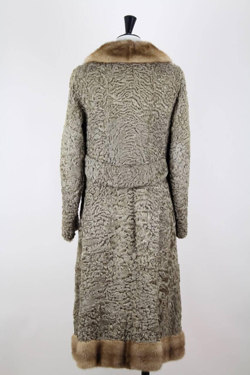 Amazing taupe (brown-grey) genuine Persian lamb or astrakhan fur coat with light brown mink fur collar and hem. The coat features a slim slightly flared and very flattering silhouette with a lamb fur backed notched collar which may be styled up or
