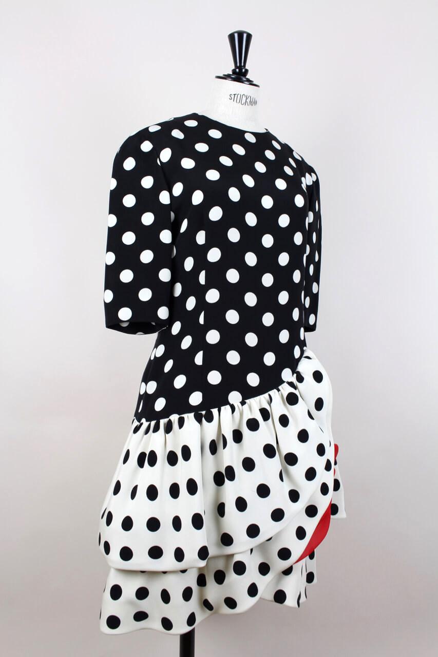 Flamboyant 1980s signature polka dot design silk dress in black, creme-white and bright red by AKRIS of Switzerland. This knee-length dress is inspired by traditional Andalusian flamenco dresses and features all the typical characteristics with its