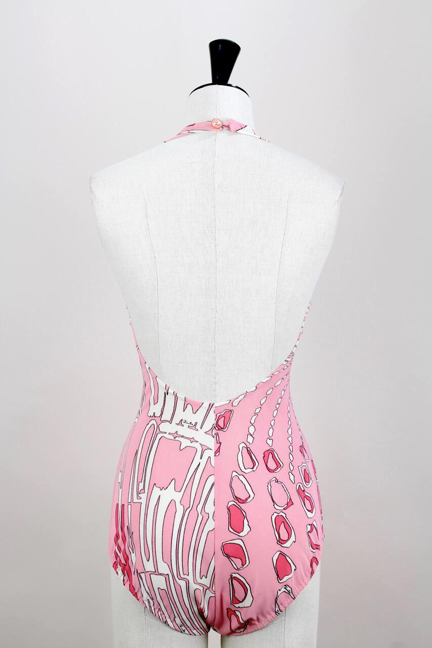 Add a dose of Emilio Pucci's 1960s signature jet set glamour to your beachwear or vintage fashion collection. This fabulous and rare one-piece vintage swimsuit is splashed with Pucci's iconic African inspired 