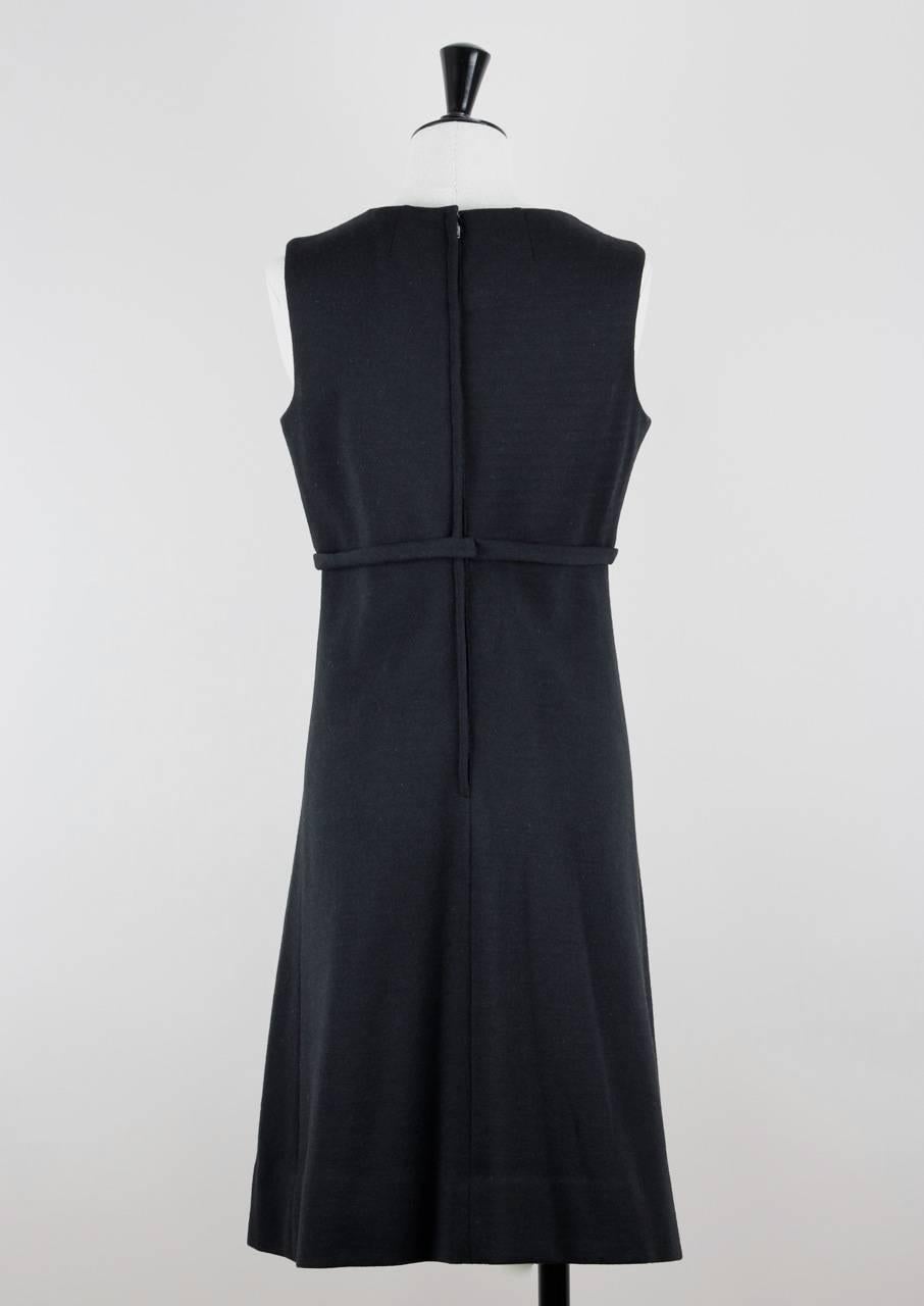 This classy sleeveless little black dress features a V-neckline, a bow detail under the bust and an inverted pleat to the skirt. It fastens up the back with a 51 cm - 20.1