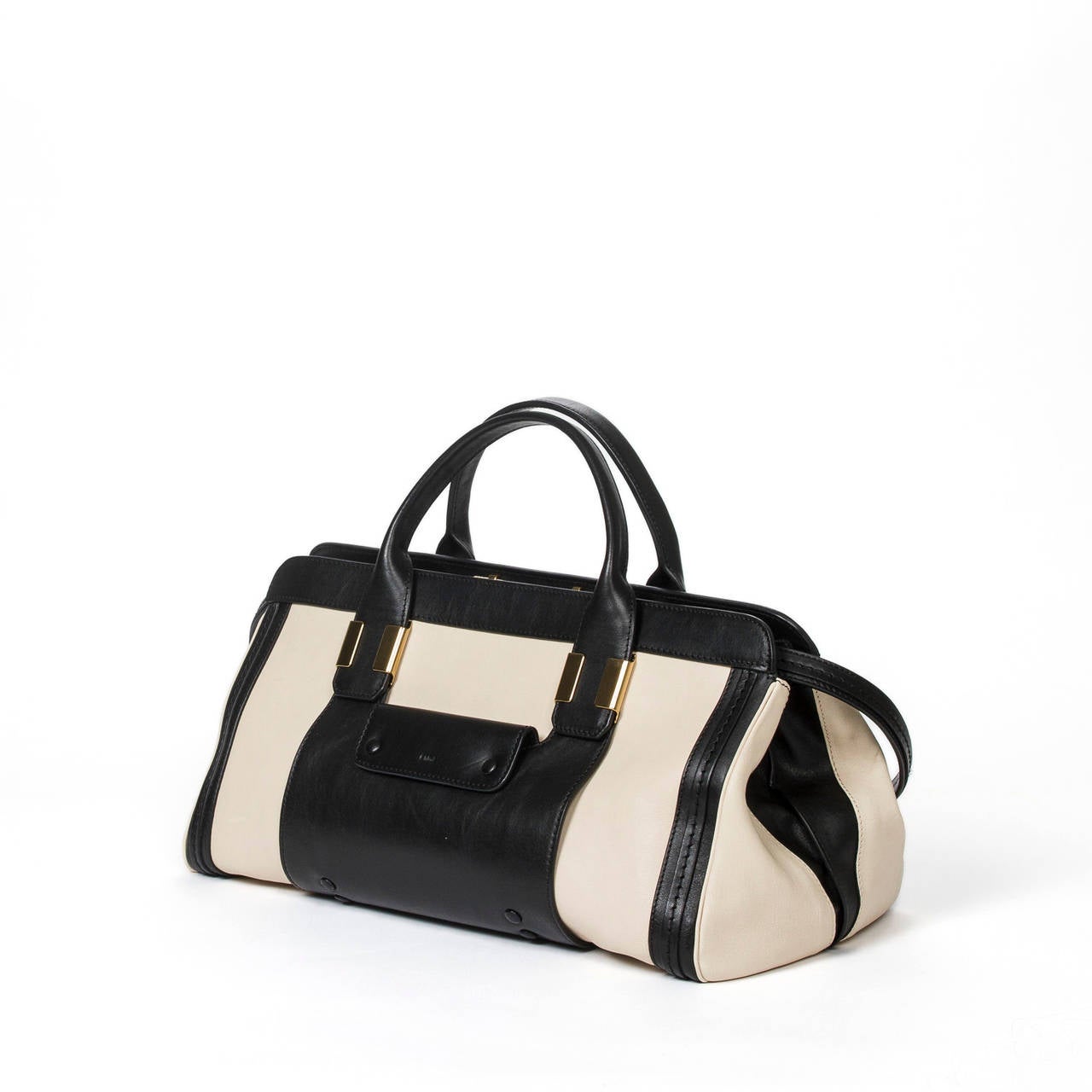 Alice 2way bag in cream and black leather with black leather removable strap, gold tone hardware, snap button closure front pocket and slip back pocket. Black fabric lining with one slip pocket and one zip pocket. Dustbag, authenticity card and care