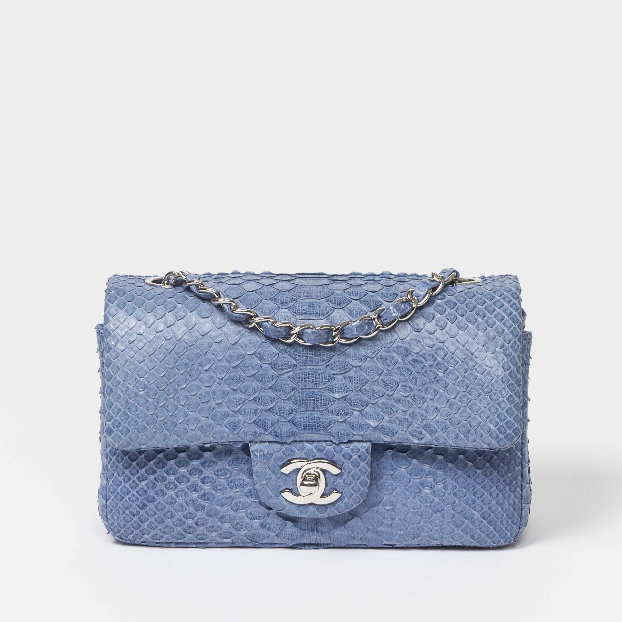 Mini Flap in powder blue python skin, silver chain strap interlaced with python and CC turnlock. Back slip pocket. Denim blue leather lined interior with one slip pocket and one zip pocket. Engraved metal plaque 