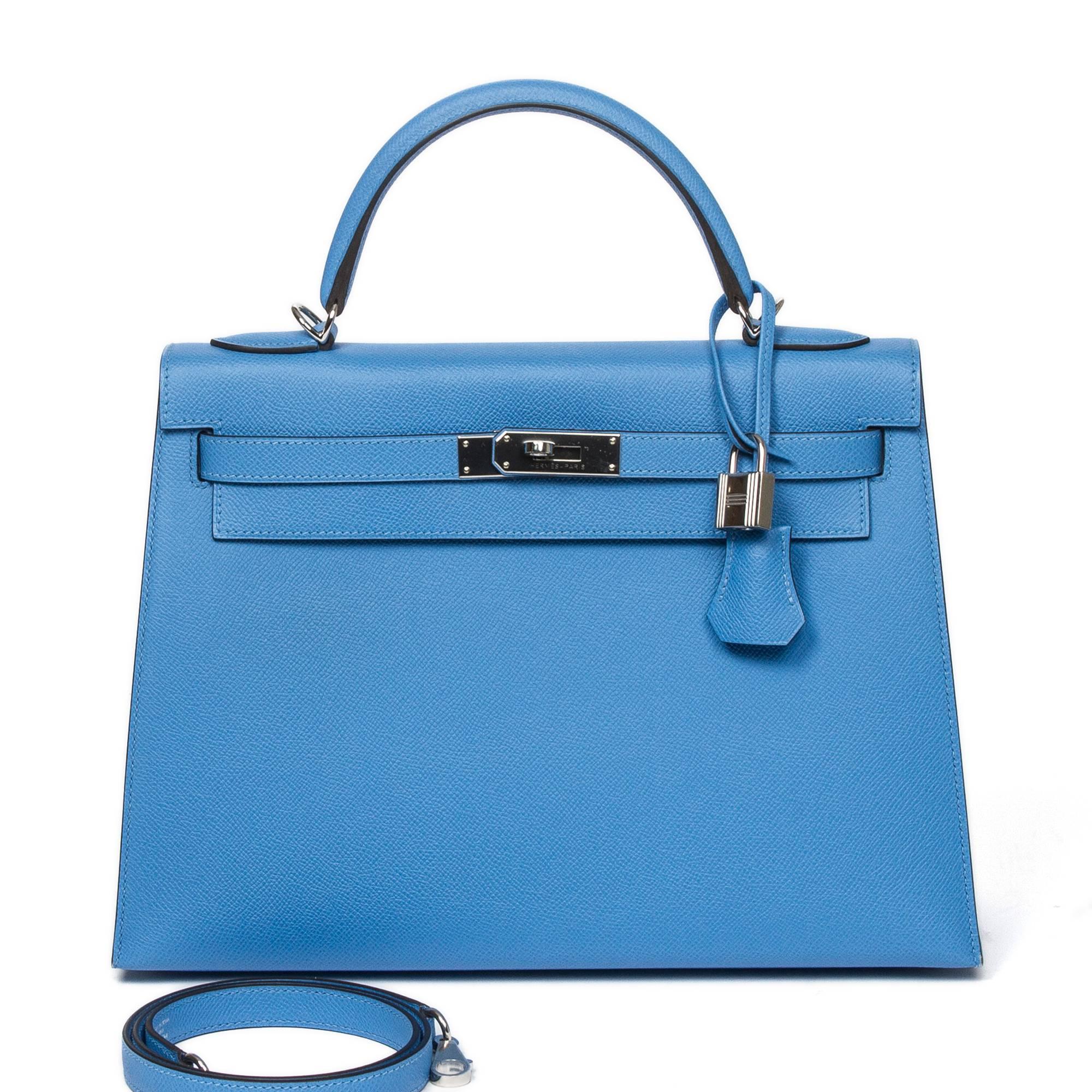 Kelly 32 in Blue Paradise Epsom leather with cadenas and keys in clochette, silver tone hardware. Blue Paradise chèvre leather lined interior with 2 slip pockets and one zip pocket. Stamp T. Model from 2016. Box, dustbag, pouch for accessories and