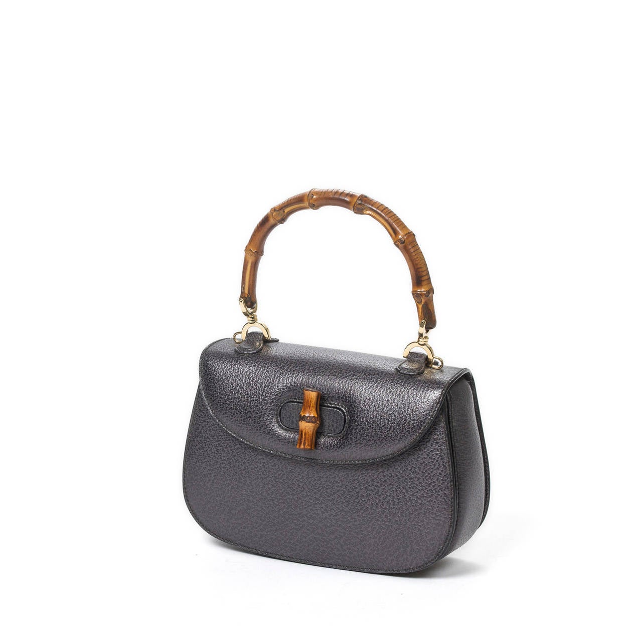 Bamboo handbag in grey grained leather with bamboo handle and leather strap, silver tone hardware. Grey suede leather interior with 3 compartments which one is zipped. Brand new condition.