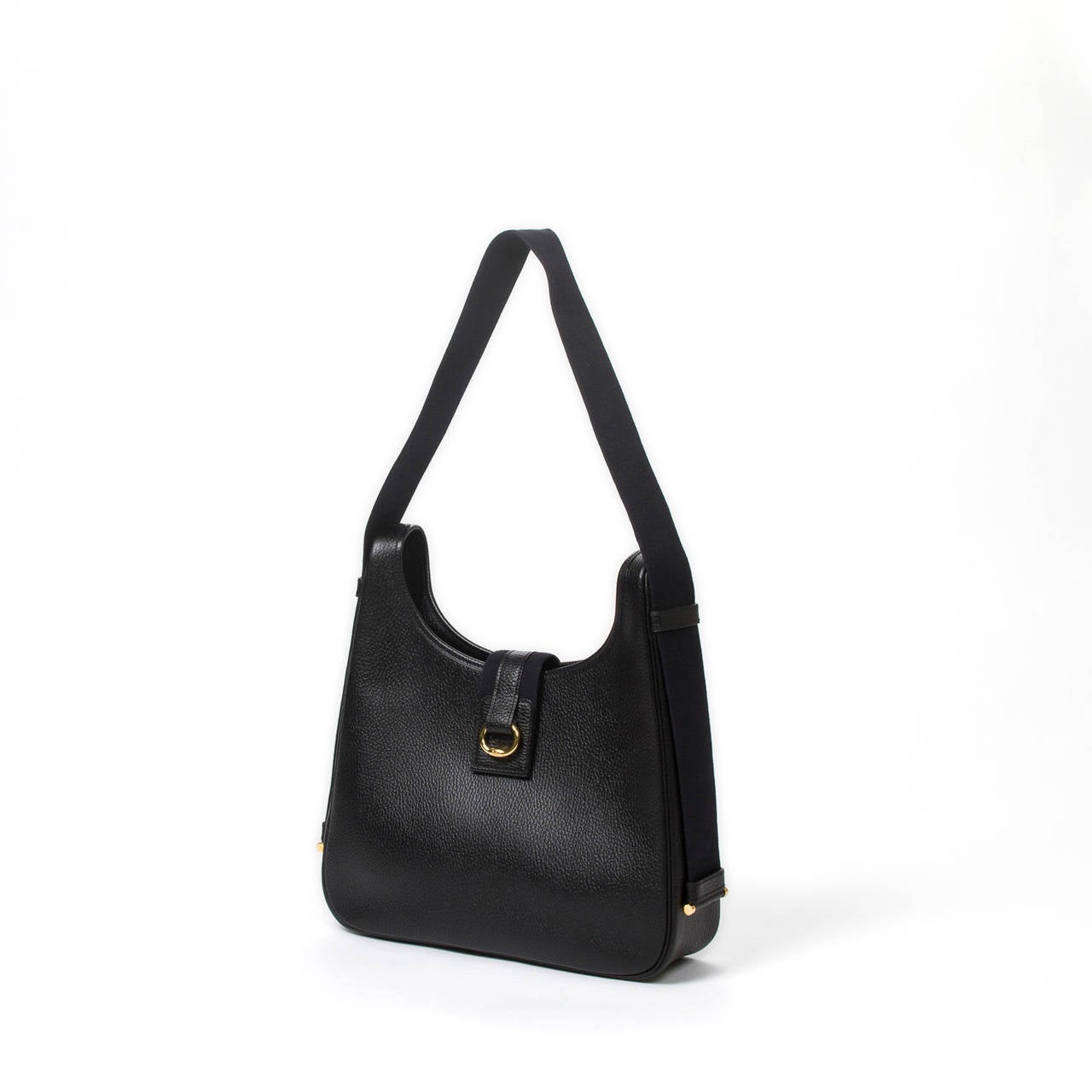 Tsako in black ardennes leather with gold tone hardware. Black leather interior with 2 pockets which one is zipped. Stamp F in square (2002). Dustbag included. Pristine condition.