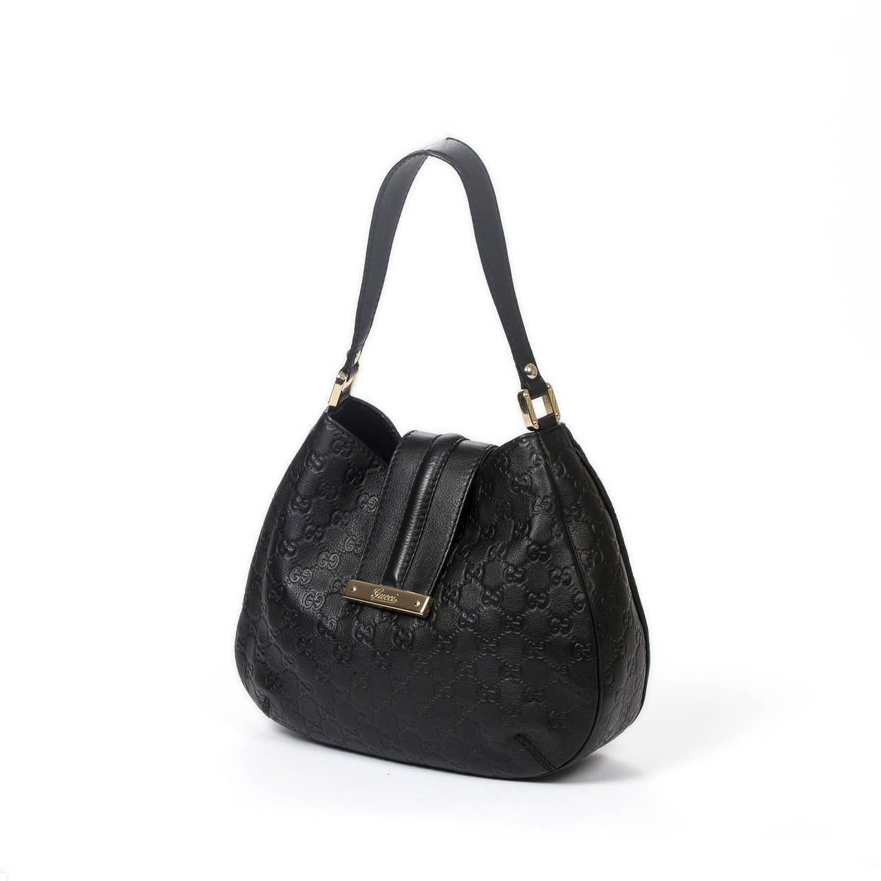 Gucci Handbag in black monogrammed leather with light gold hardware. Lined interior in black canvas monogram. Perfect condition.