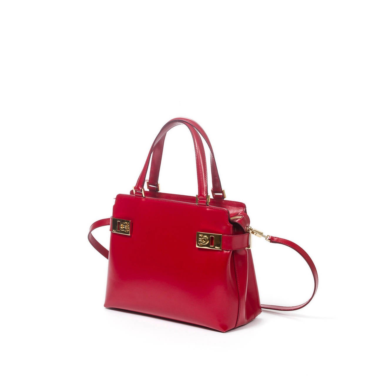 Ferragamo Handbag 2way in red leather. Gold tone hardware. Handles and strap in red leather. Lined interior in black canvas. Excellent condition.