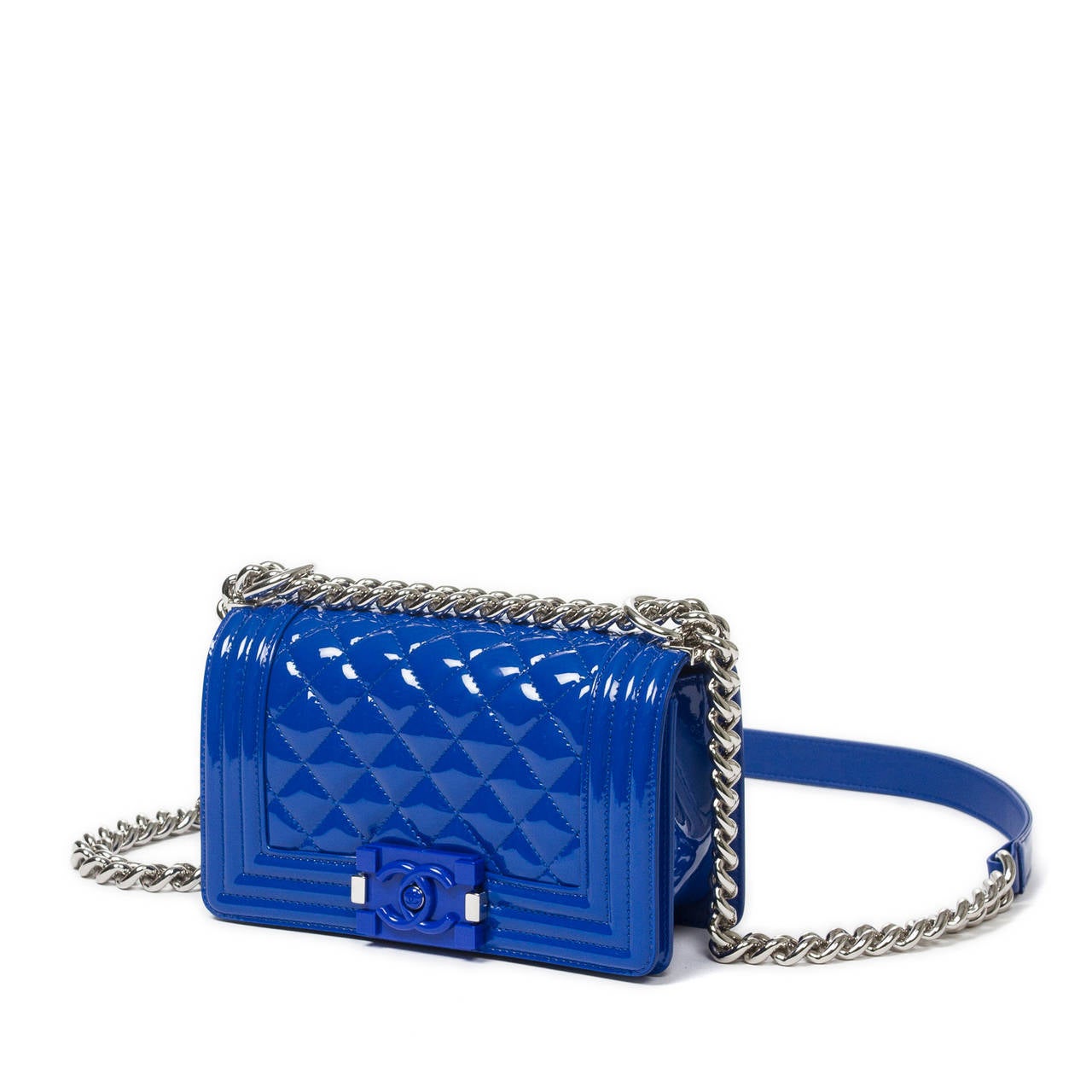 Mini Boy in electric blue quilted patent leather with leather and chain strap, silver tone and bakalite clasp closure. Black canvas lining with one slip pocket. Model from 2015. Box, dustbag and all papers included. Mint condition.