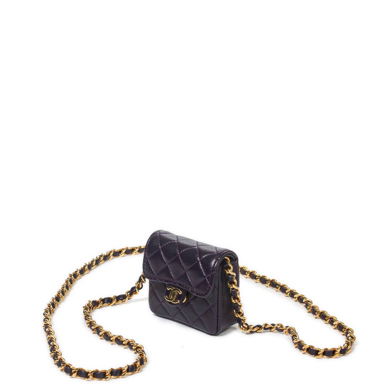 Necklace/shoulder bag Mini Timeless in dark purple quilted leather with gold tone chain strap interlaced with leather. Box, authenticity sticker and card included. Model from 1989 to 1991. Perfect condition.