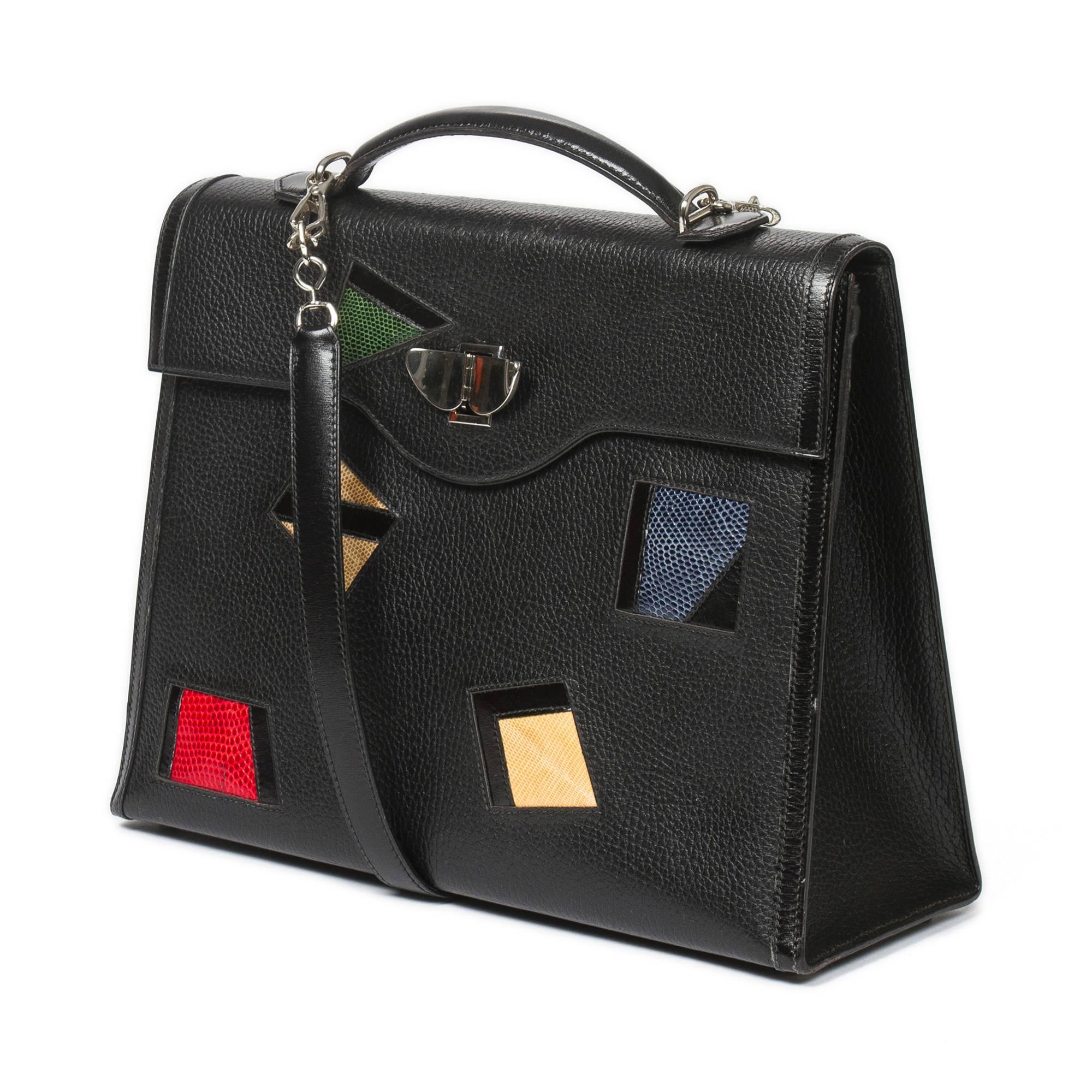 Fantastic Collector Kelly Nuage in black Ardennes, embellished with multicolor lizard skin patchwork, handle in black leather and shoulder strap. Special nuage clasp in palladium. Red leather interior lining with one zipped pocket two slip pockets.