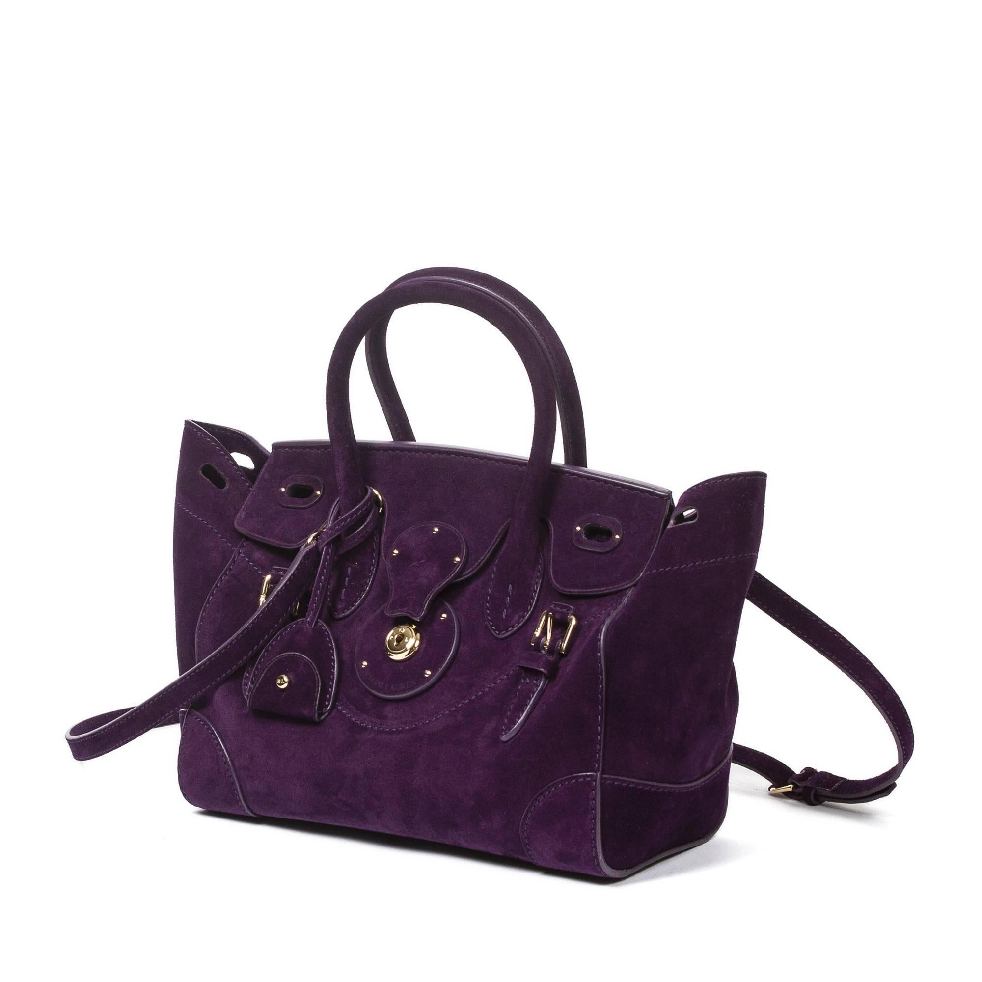 Ricky SM in violet suede with engraved gold tone closure, keys in clochette and optional shoulder strap. Taupe leather lined interior with one violet suede slip pocket. Dustbag included. This bag has kept its shape very well. Mint condition