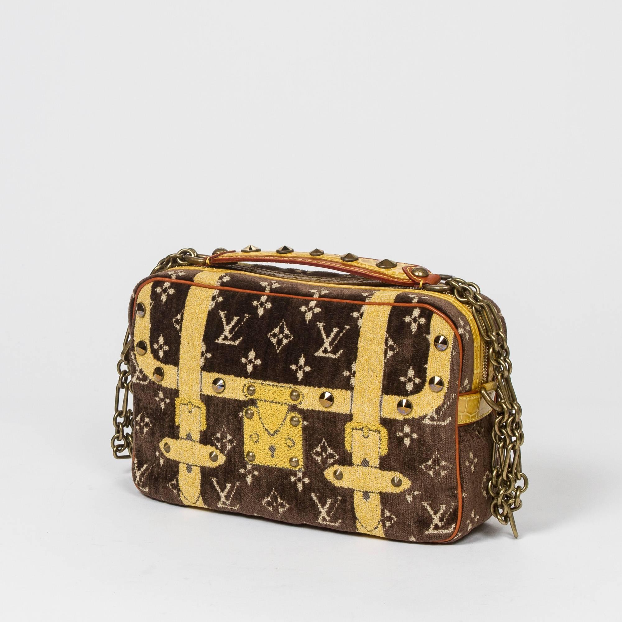 Trompe L'Oeil Pochette Runway 2004-2005 Fall/Winter Collection in brown, beige and yellow monogram motif terrycloth with crystal studs, yellow alligator skin and vachetta accents and antique gold tone chain strap. Top zip closure. Brown leather