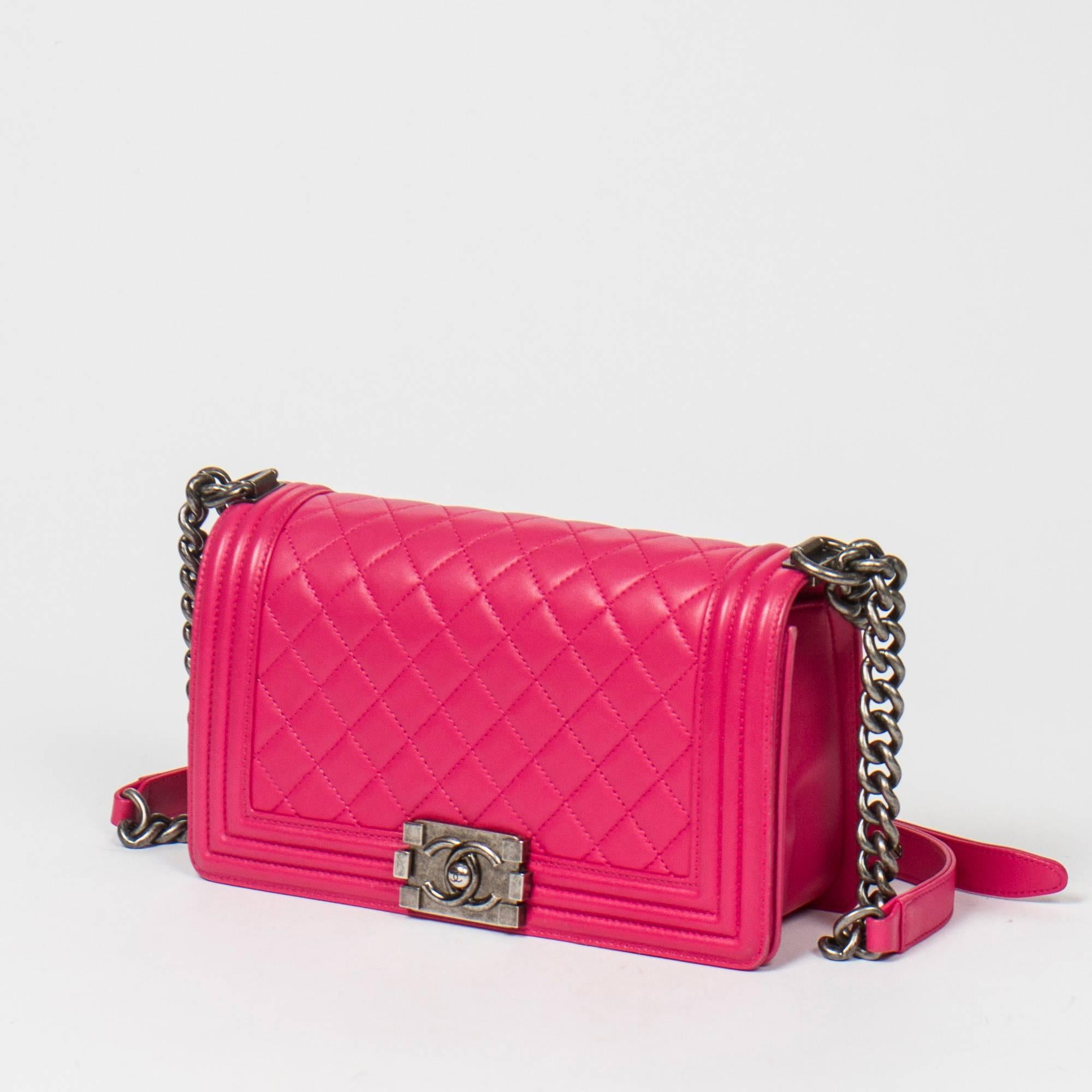 Boy by Chanel in Fuschia quilted leather with Brushed silver chain strap and fuschia leather. Full flap with clasp 