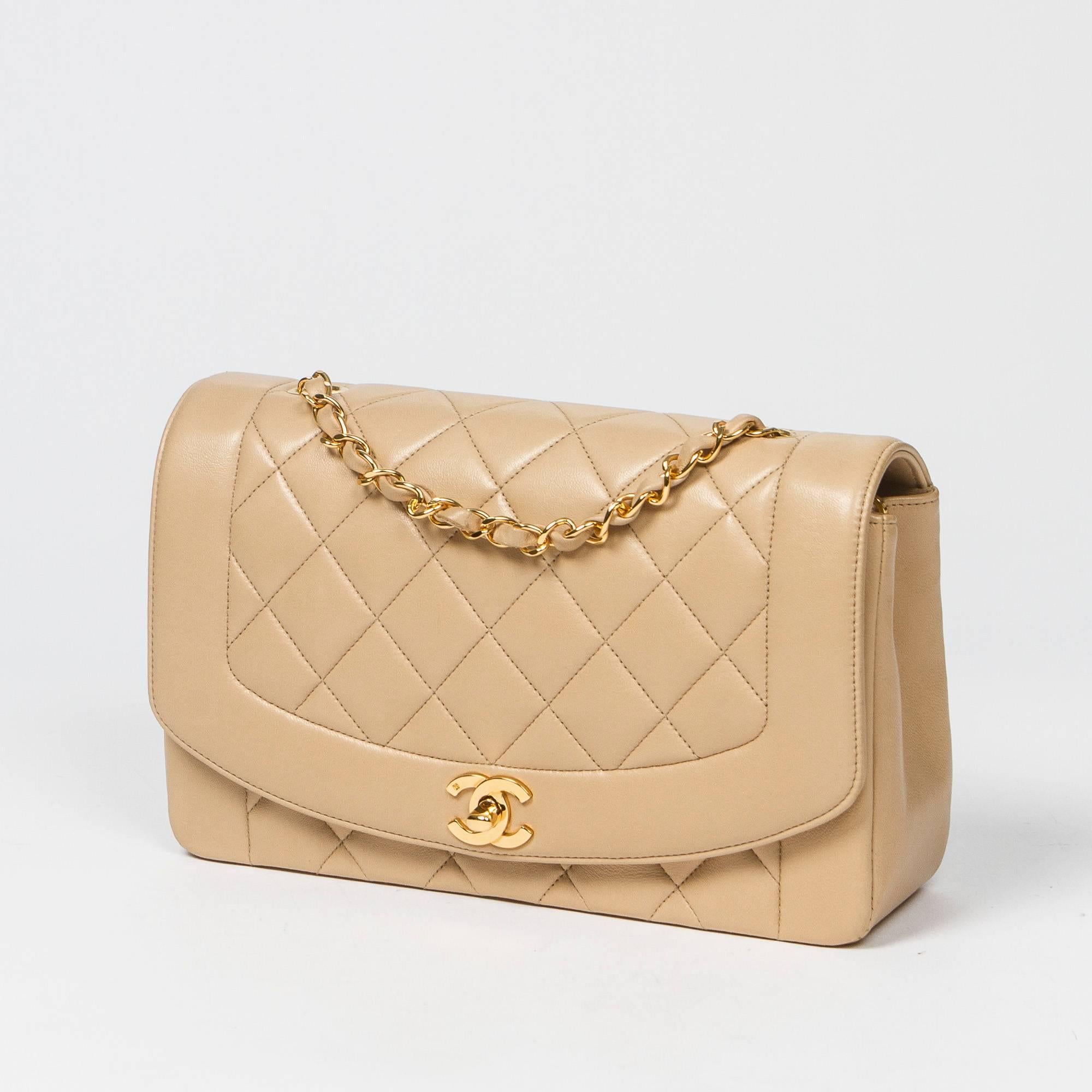 Mademoiselle Flap in beige quilted calf leather, double chain strap interlaced with leather, signature turnlock closure, gold tone hardware. Back slip pocket. Beige leather lined interior with 3 slip pockets. Gold tone heat stamp 