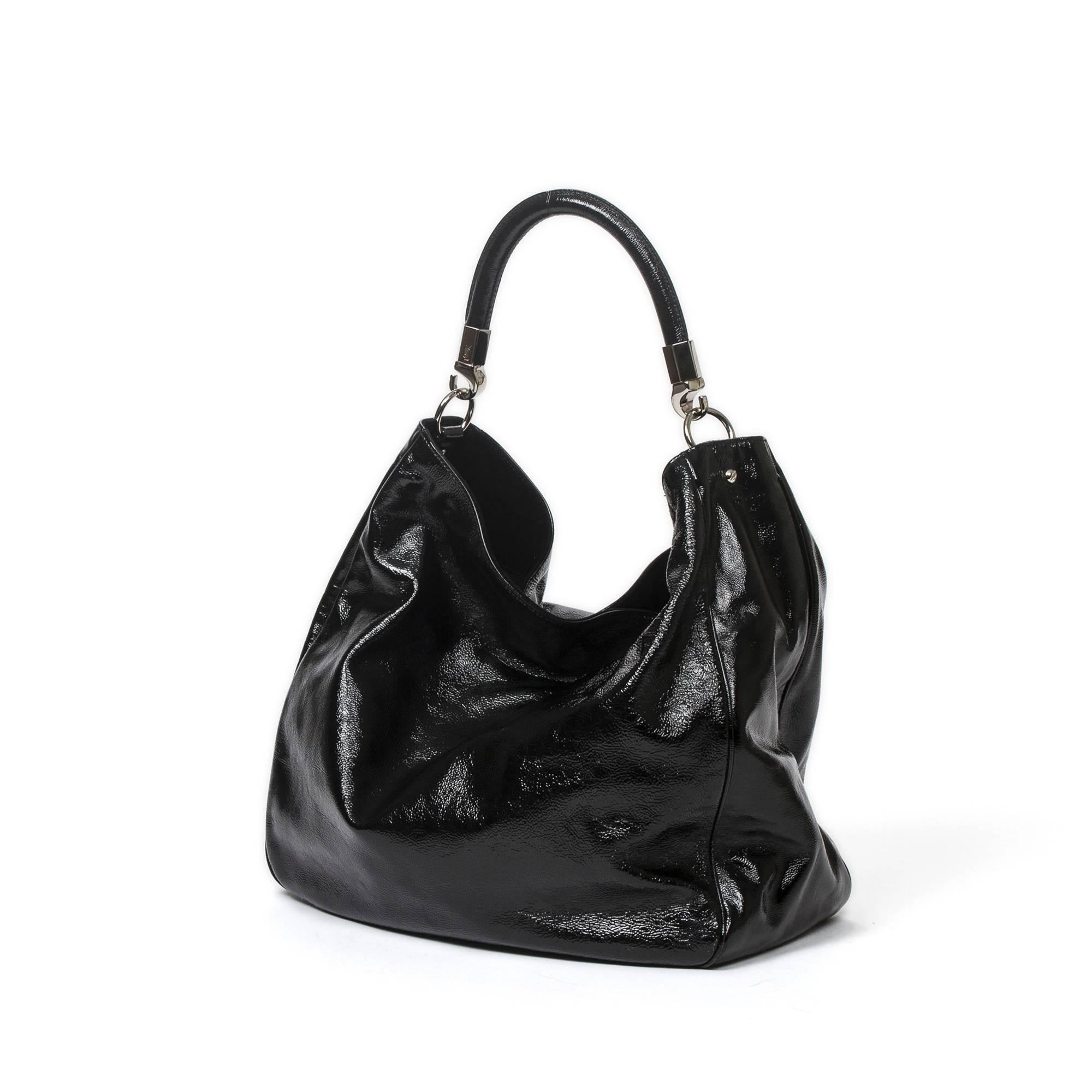 Yves Saint-Laurent	Roady 35cm in black distressed patent leather with black patent leather handles (22cm) and silver tone hardware. Dustbag included. 
Perfect condition.
