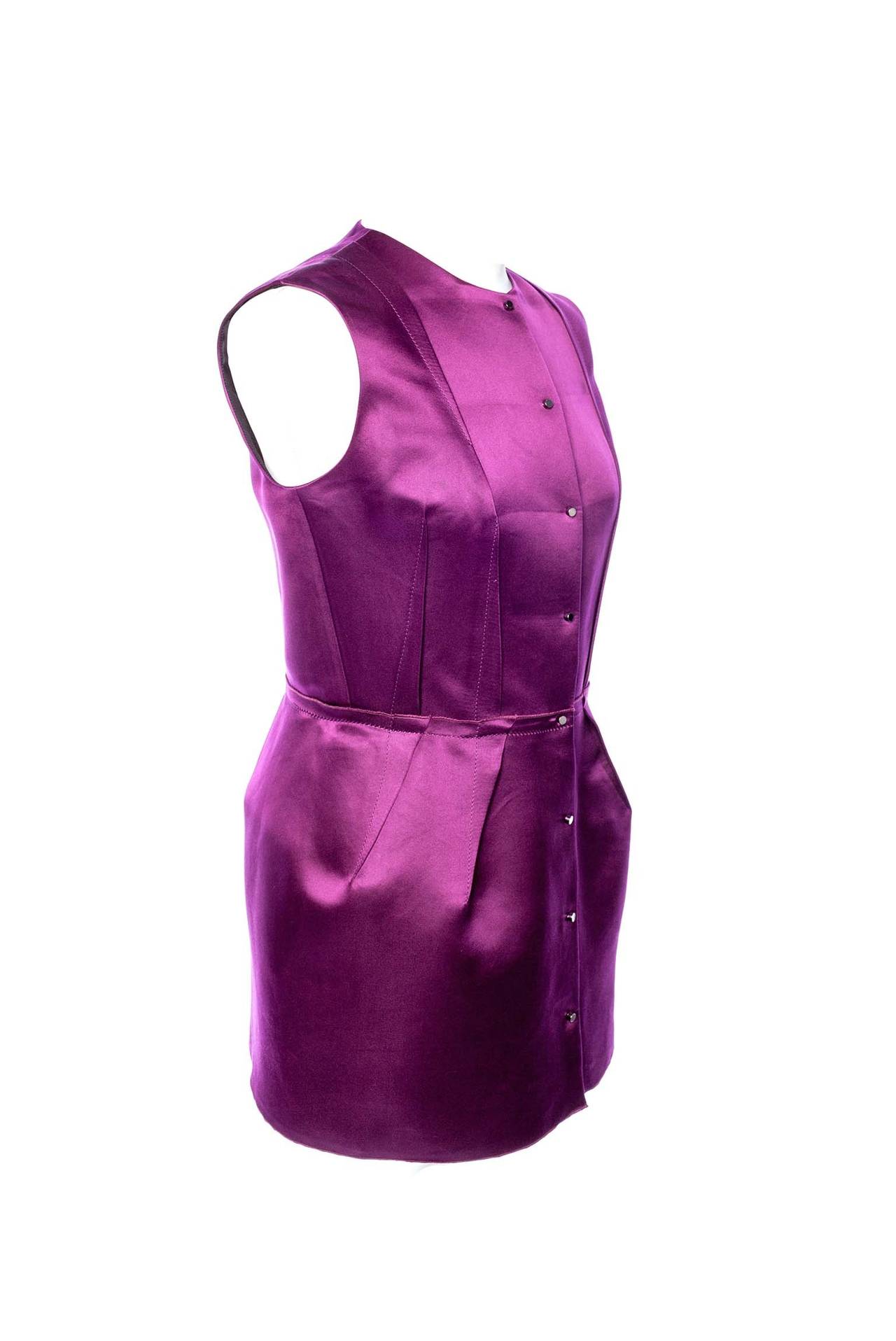 Lanvin deep purple winter 2007 sleeveless dress. This item can function as either a micro dress or longer top, 8 unusual snaps, exposed seam work, fully lined. This item has the feel of a couture shape, standing away from body. A great piece from
