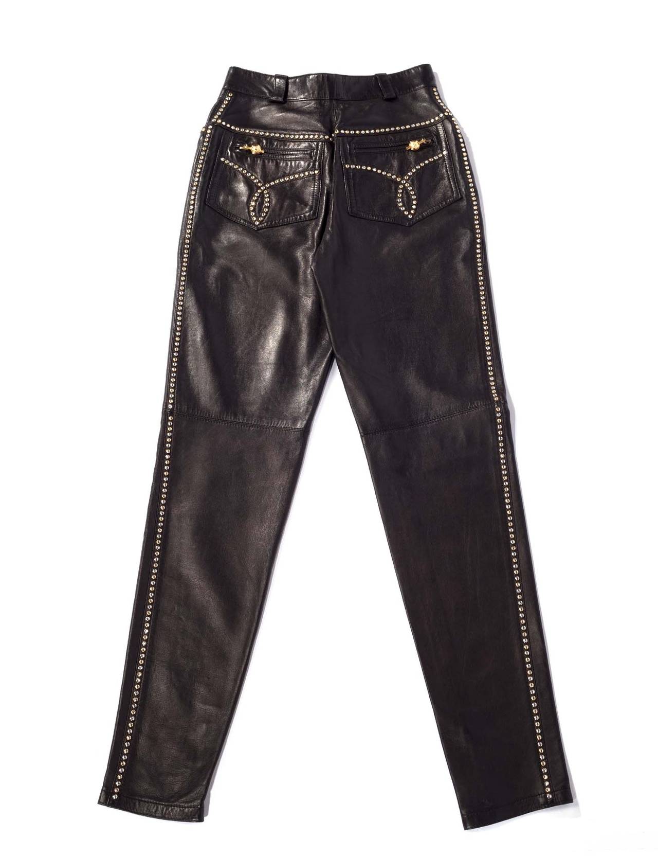 Gianni Versace Vintage leather studded high waisted pants. Pants have 2 front pockets, 2 back pockets with zippers and medusa zipper pulls. Pants are studded at side seam, back yolk and front pockets, seams at knees, half lining, and inseam zippers