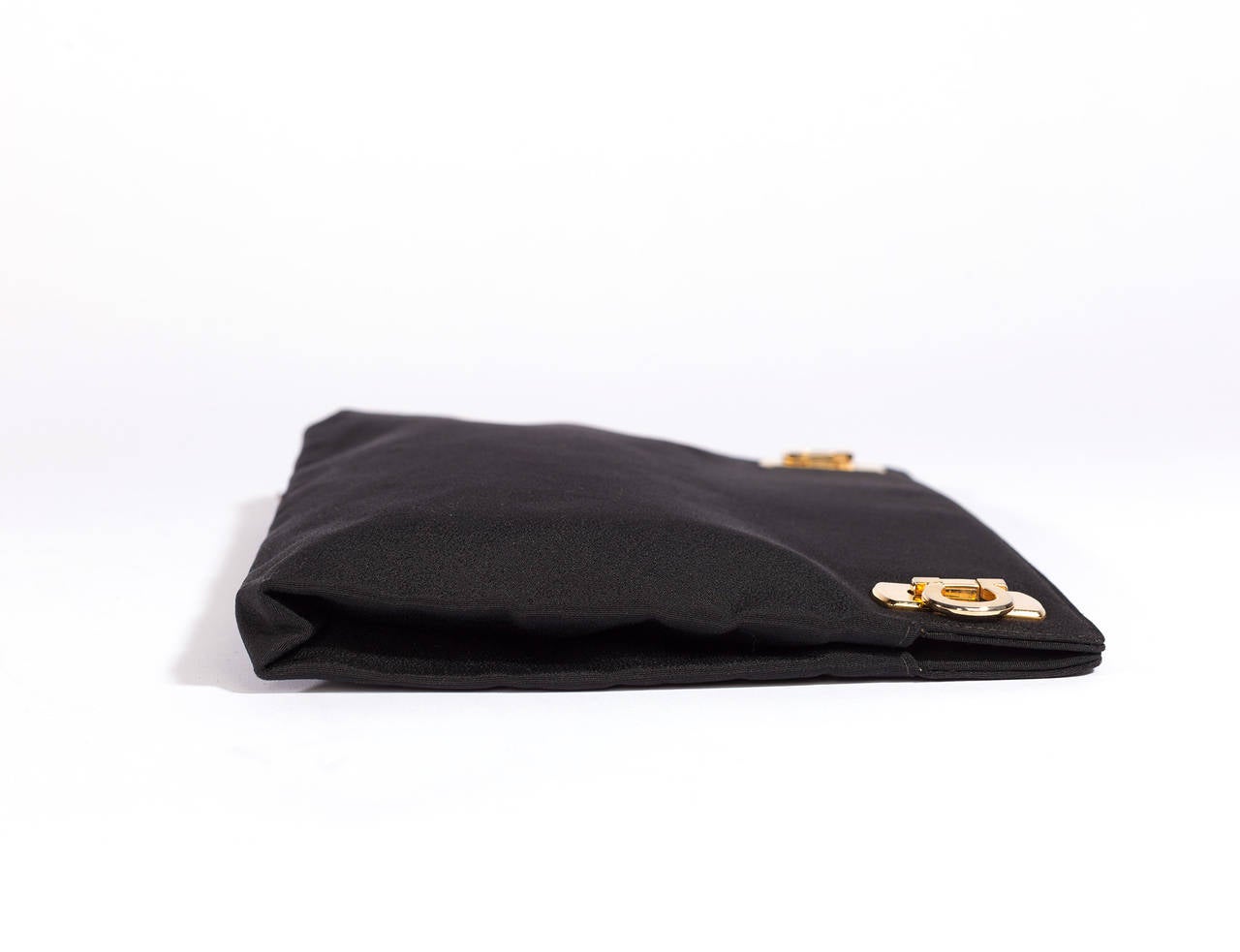 Salvatore Ferragamo Matte Black grosgrain clutch. Clutch has 2 gold clasps and has 1930's feeling, extremely high quality and well executed.
