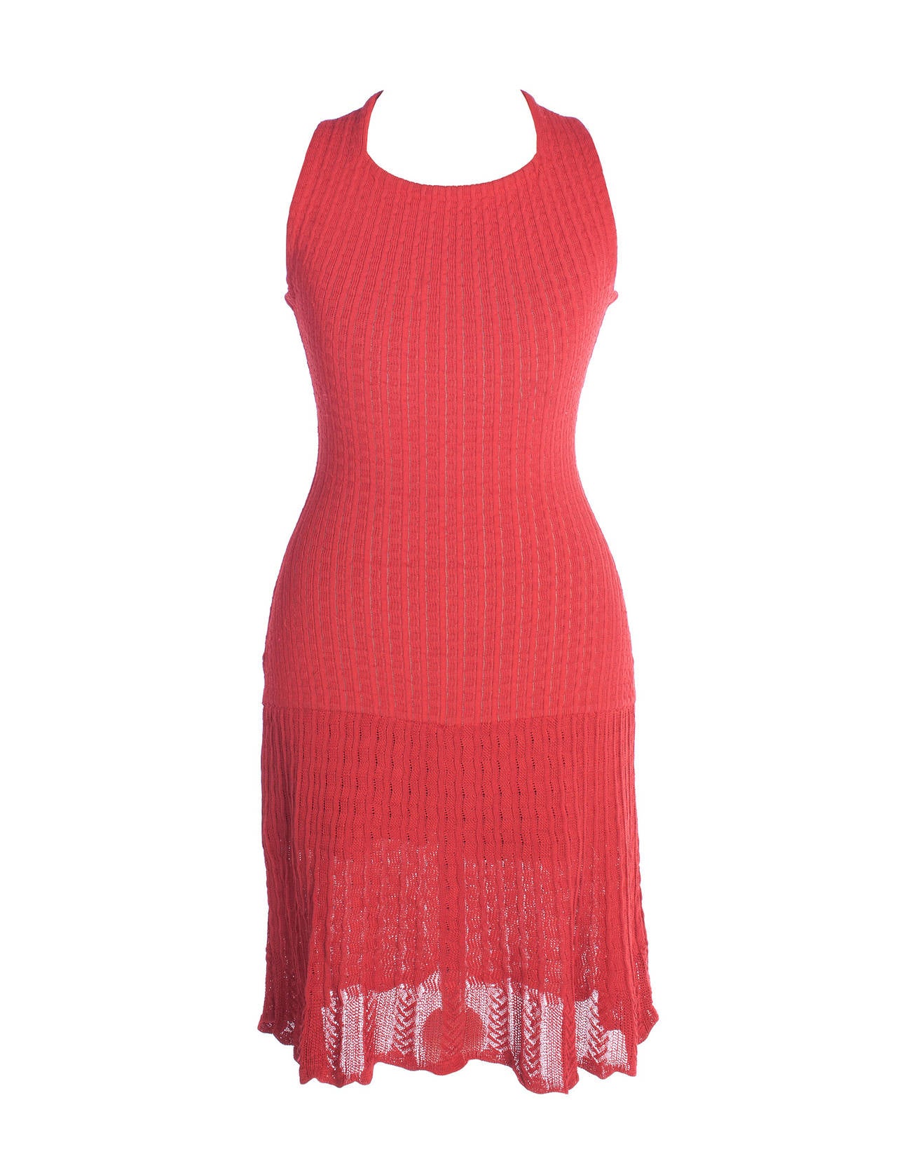 Azzedine Alaia knitted dress in salmon color. Dress has iconic pointelle knitted design, tank style with hidden back zipper, body suit underwear with 2 snaps, flounce skirt in a lighter pointelle. body con micro mini style. Super sexy piece from the