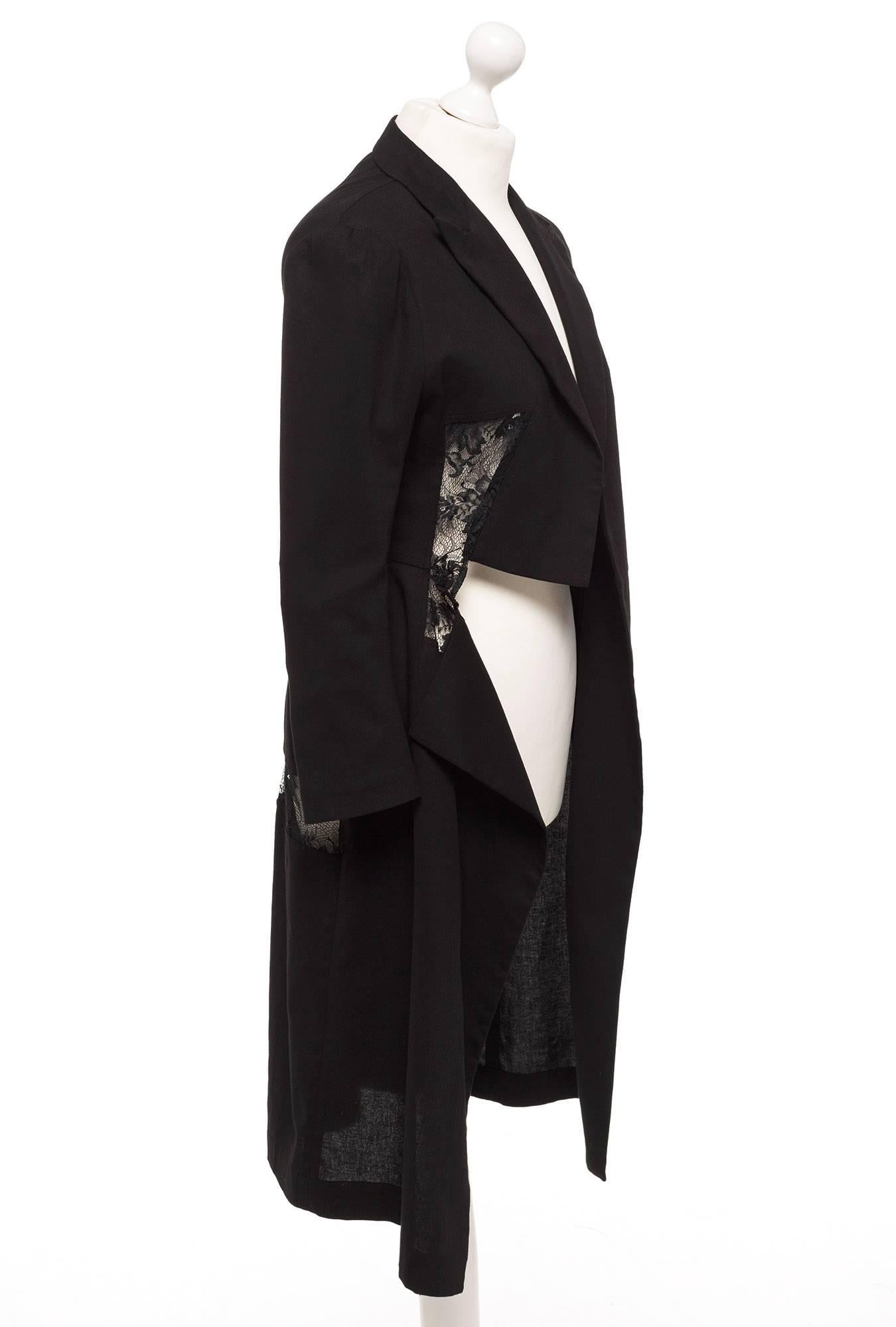 Blazer can function as a dress or long blazer but there are no buttons for closure, 3/4 sleeves, lace front and back details, notch collar, and hanging front panels. A master piece from our favorite designer Yohji Yamamoto. This is from the