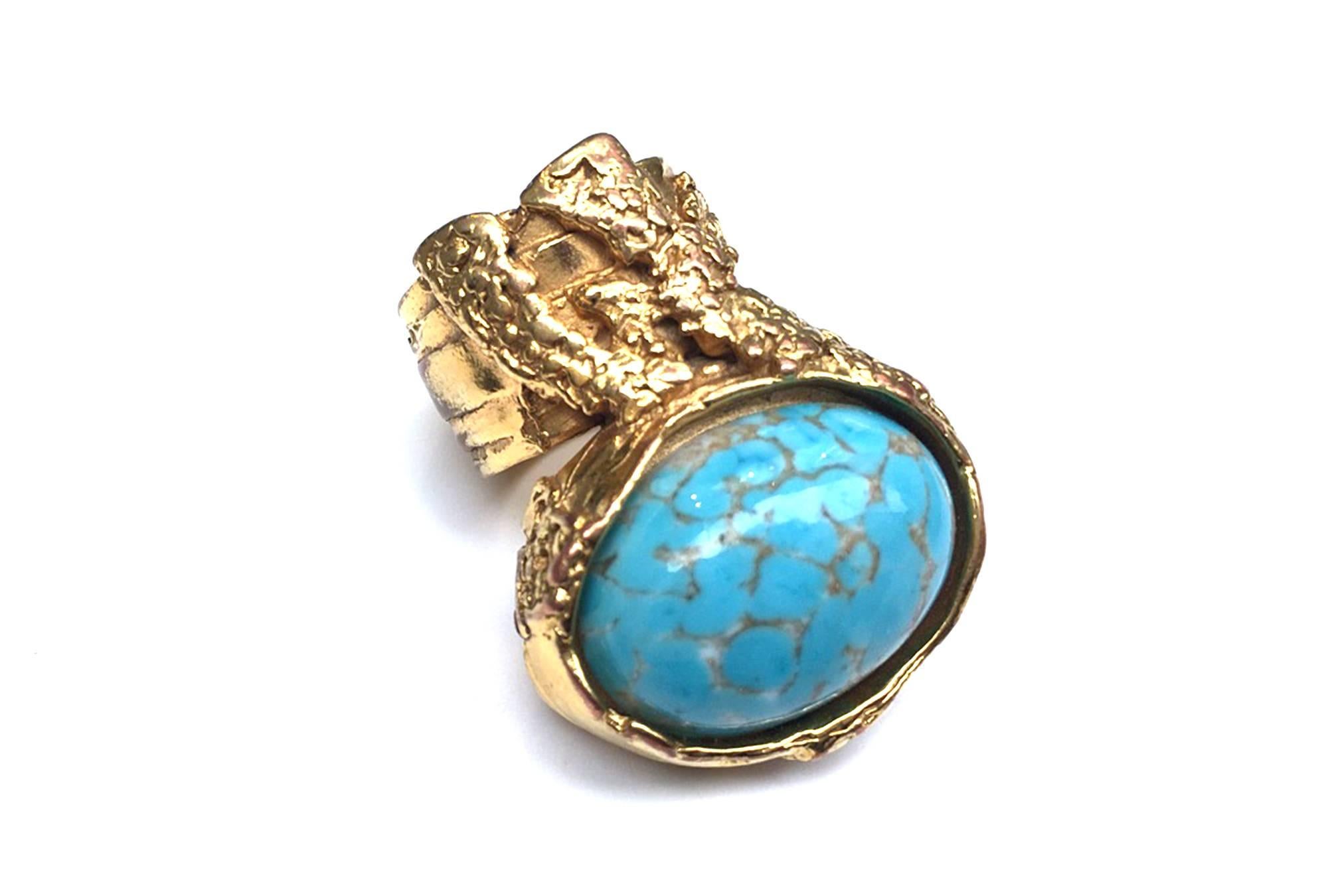  YSL Arty Oval Ring with Turquoise Stone & Gold-Toned Finished Metal by Stefano Pilati for YSL.  Pilati is trying to show the relevance of the heritage through a contemporary eye.
Large, US size 9, EU size 60.