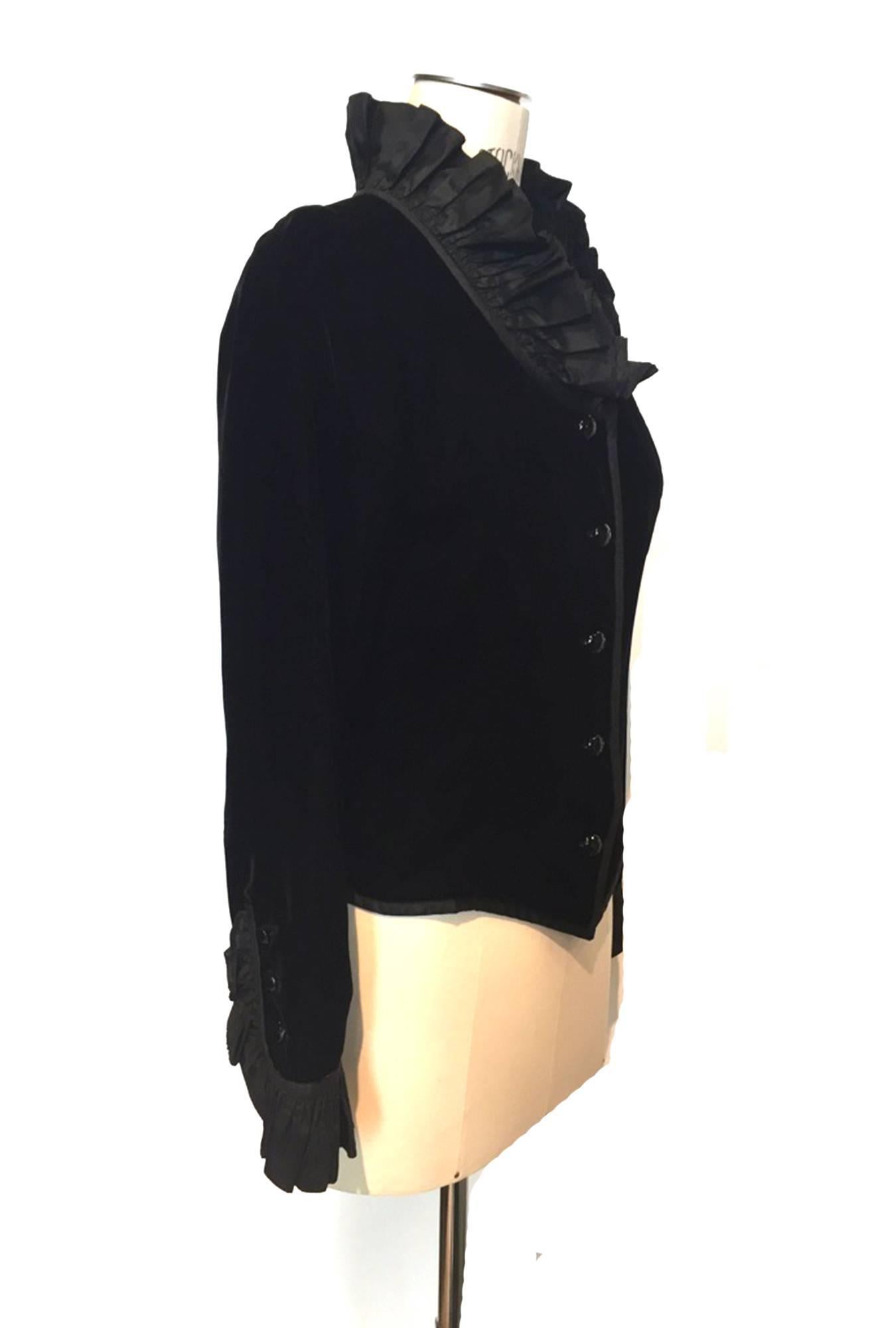 A Rare vintage classic from the fashion master Yves Saint Laurent. Jacket is softly shaped with black velvet fabric, pleated front and back moire neck detail, also on sleeve cuffs. A collectable Saint Laurent (YSL) vintage piece.