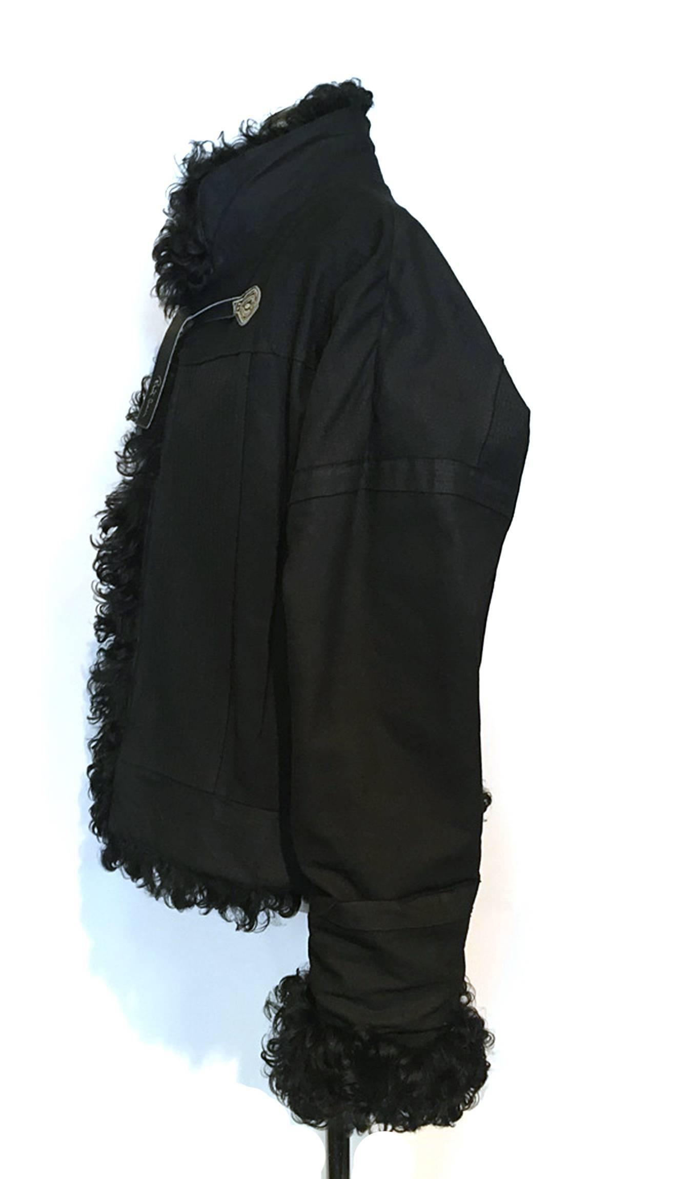 RARE Roberto Cavalli cotton and fake fur puffer Jacket w. signature logo on leather straps. 