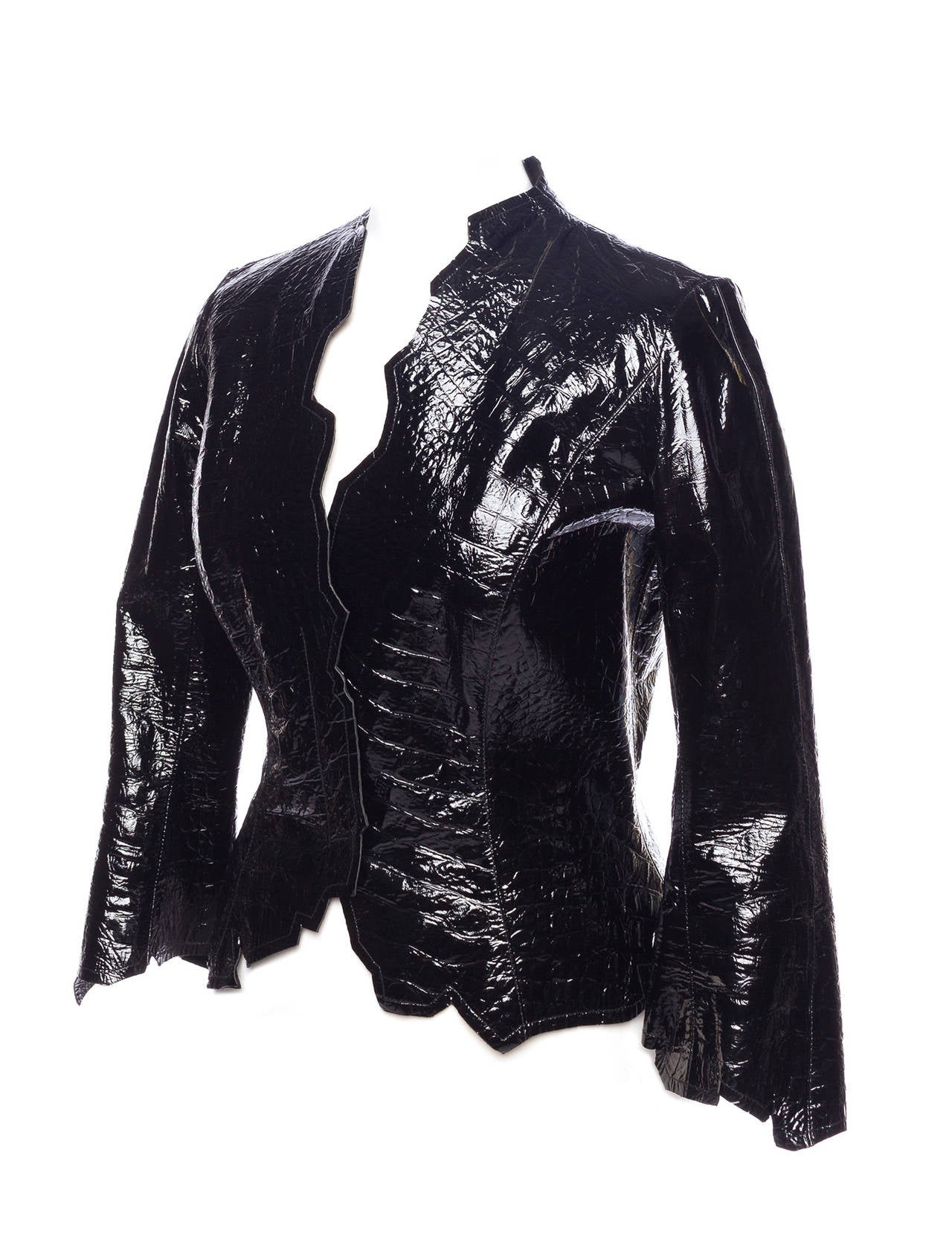 Mugler by Thierry Mugler coated leather embossed leather jacket 1990's. Jacket has raw edged details, and is made from a shiny coated leather with 3 snap details, 3/4 sleeveless. This item is coming from the first secondary line from the House of