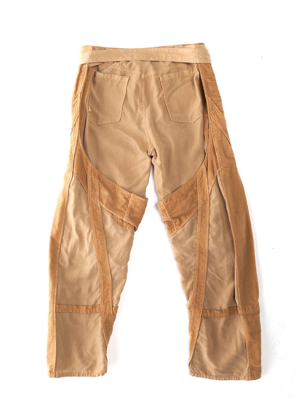 Pants have multi details and are in 2 contrasting fabrics, the details are in a sand colored corduroy, with multi pockets and loops, extra long sash for double belting, cropped and loose fit.
