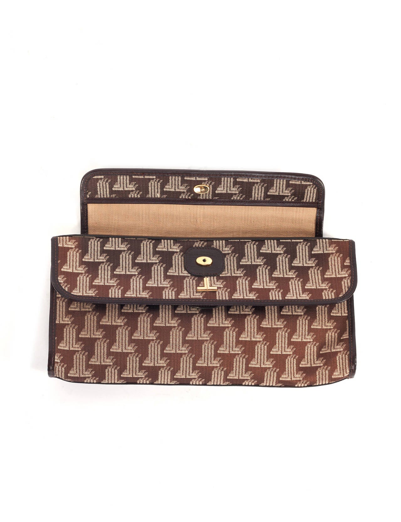 Lanvin Vintage 70's logo clutch with strap. Clutch has double flap pocket details, adjustable leather strap in dark brown, snap closure, inside zipper pockets, iconic lanvin double L logo print, leather trim, brass clips.