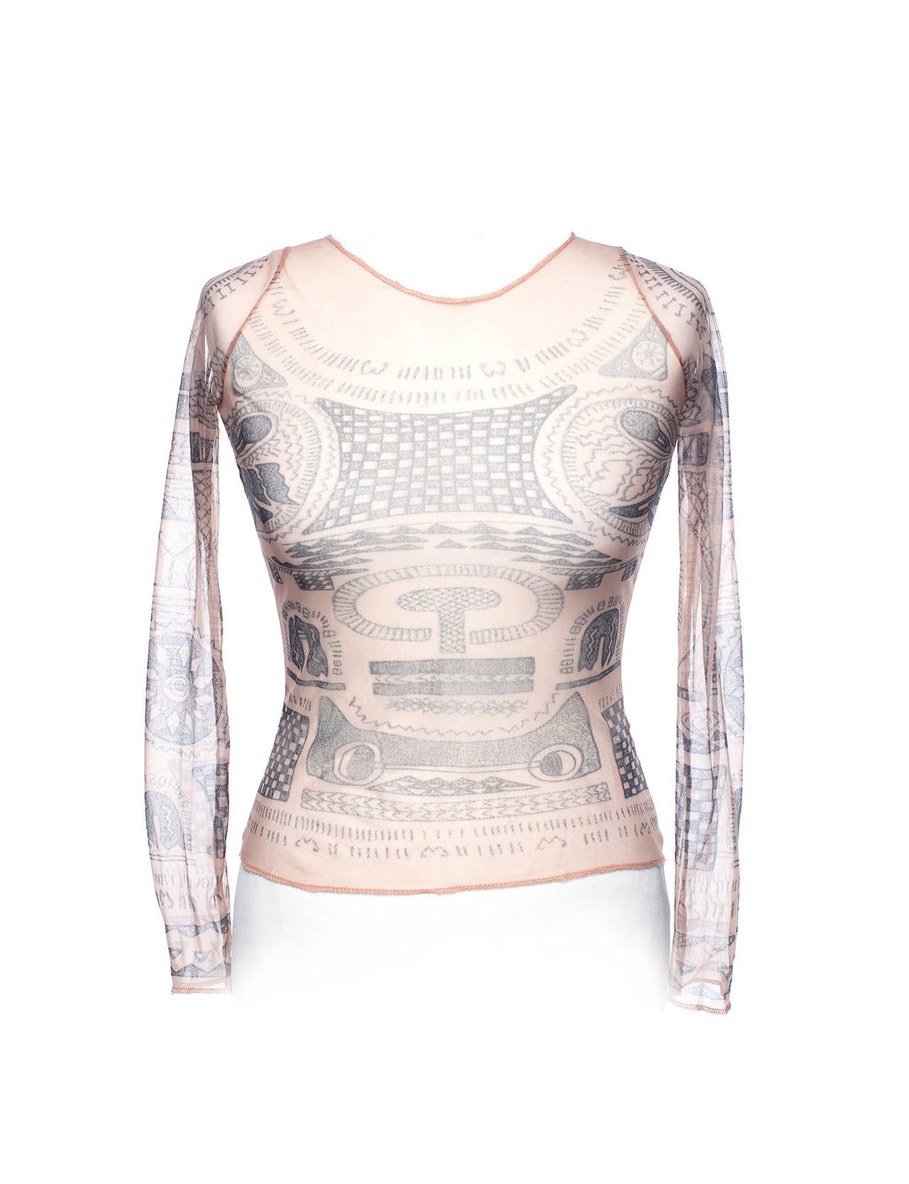 Top is printed with the now iconic tattoo print in polyamide stretch mesh. This top was meant as a layering piece to give the iilluson of body tattoo's. This item is from the very first collection from MMM and is now a replica statement fron the