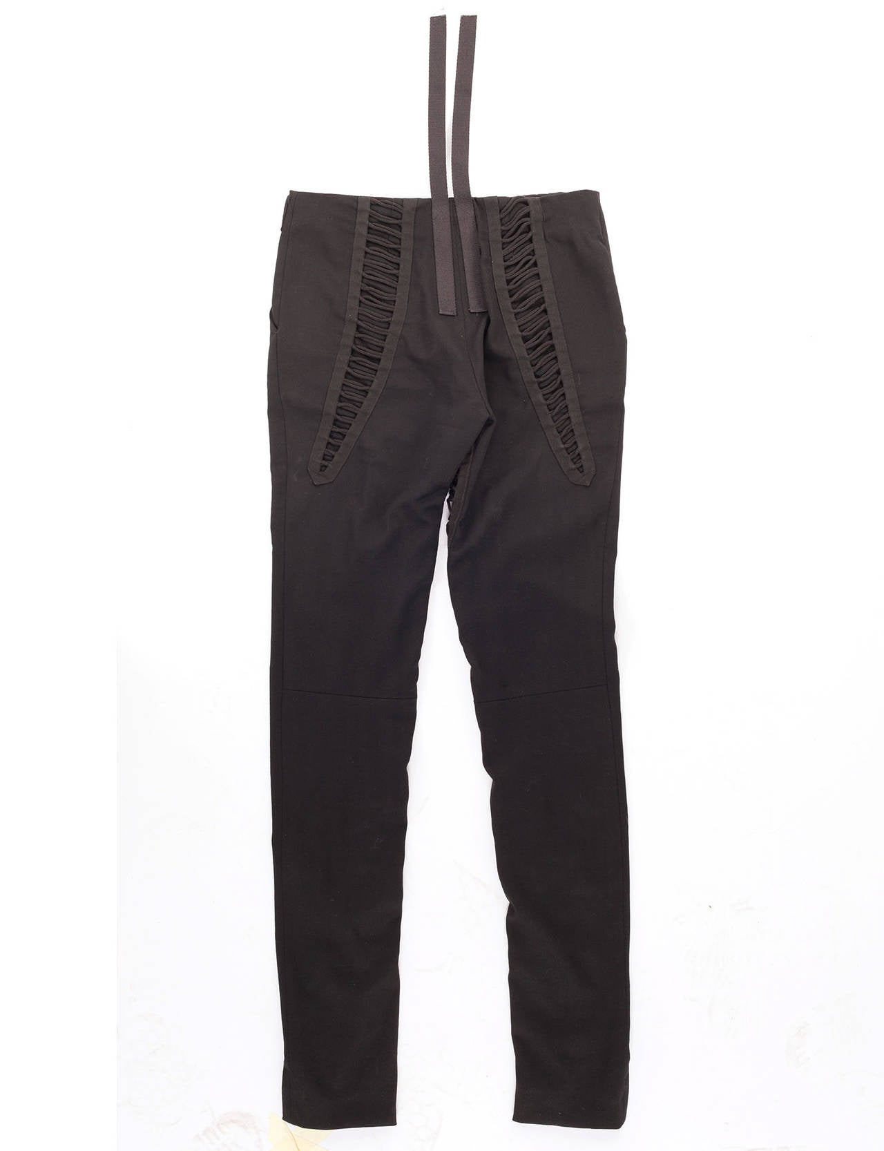 The now iconic Helmut Lang black bondage pants with multi straps, multi details in black stretch wool. What an amazing piece of fashion history.