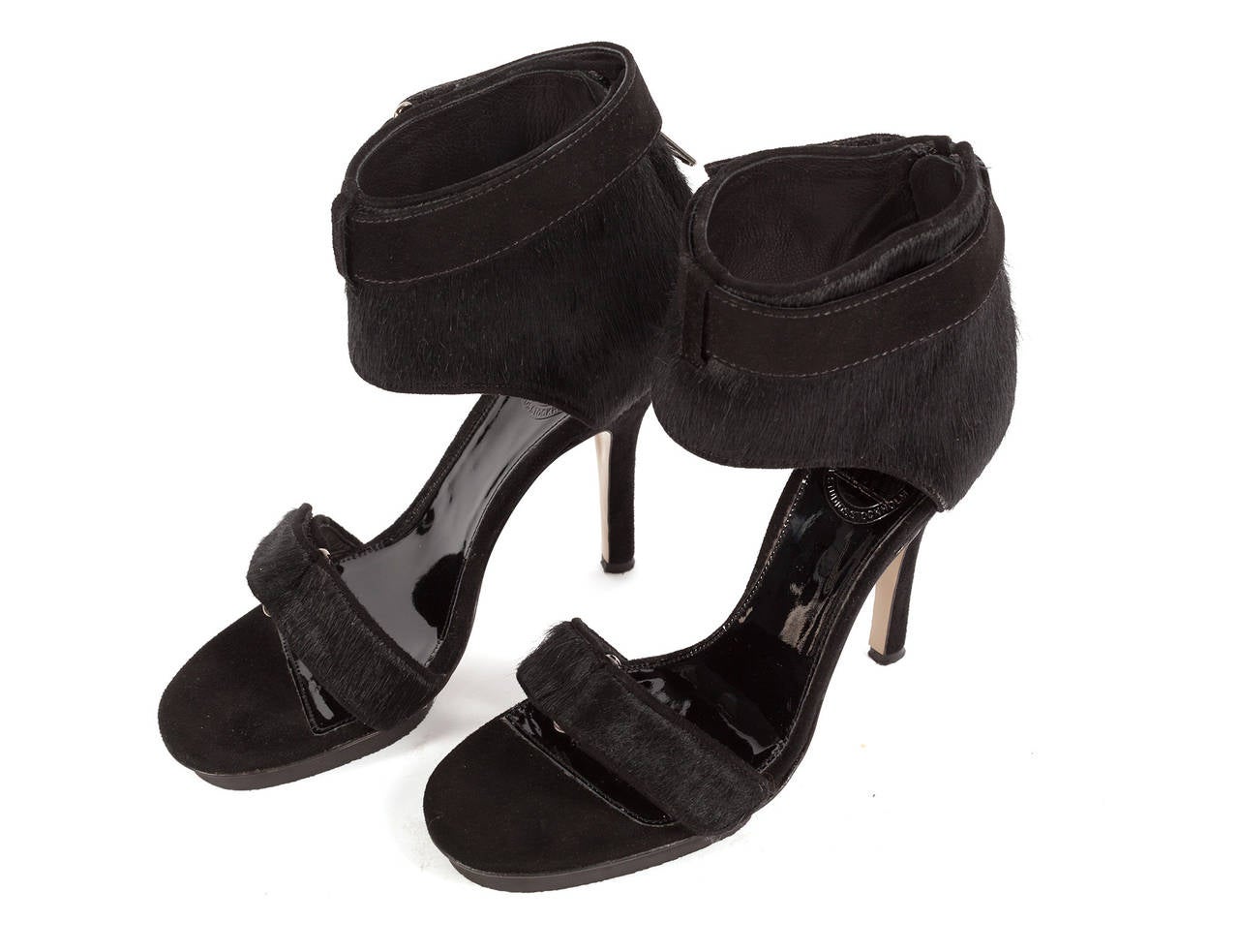 Heels have large ankle strap with strap around top of ankle velro closure, front toe strap with velcro and sexy stiletto heel in black suede.