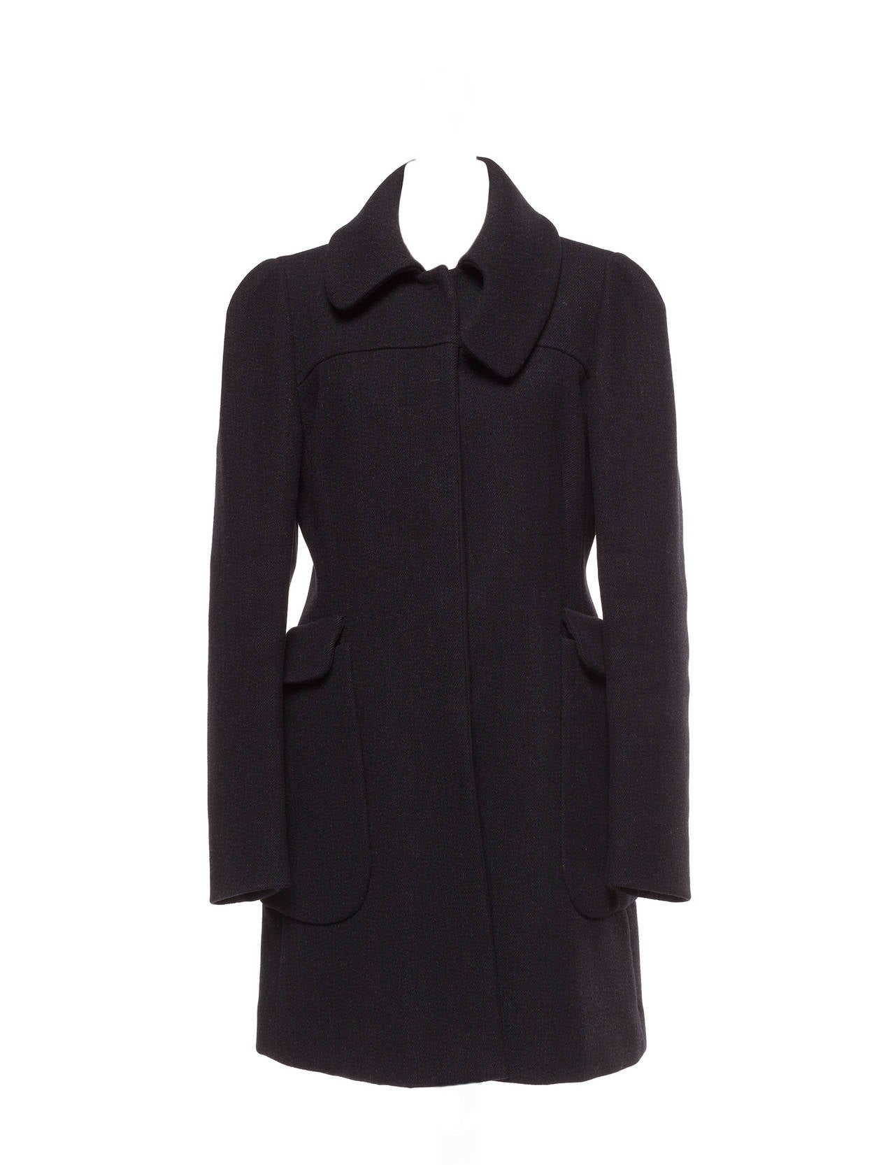 Coat has extended 90's wrap extended collar, large side pockets and stops above knees. Elegant Quality from Prada.