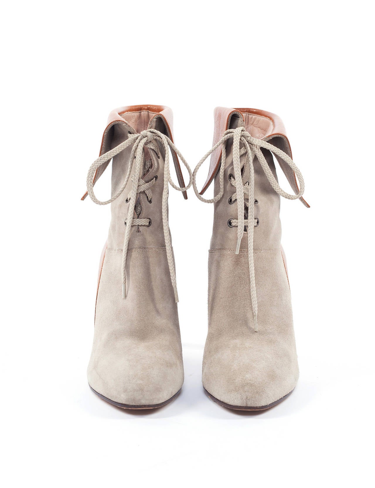 The boots are form the short tenure of Hannah Gibbon for Chloe, Butter soft Suede with contrast Flap and lace up fronts, wooden heel, Part of fashion history at the House of Chloe. US size 8, Eu size 38.