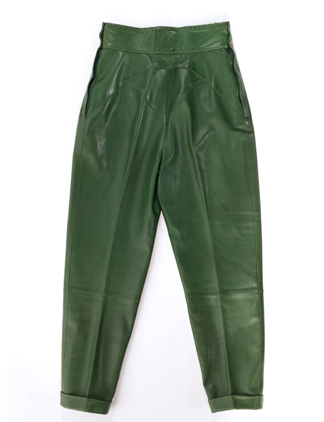 Azzendine Alaia green leather fitted trousers, with fitted waist band, front pleats side closure, Soft bottle green leather as only Alaia can do. The inside pocket lining has been damaged from use, can be repaired by professional tailor. Size French