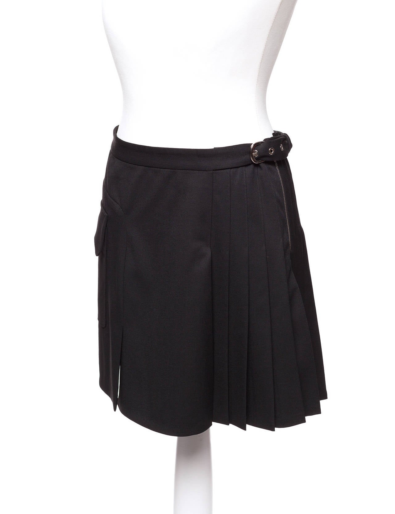 Balenciaga by Nicolas Ghesquire pleated cargo mini skirt with side belt buckle, large side pocket and fun pleated detail. Size French 40, German 36, US 8.