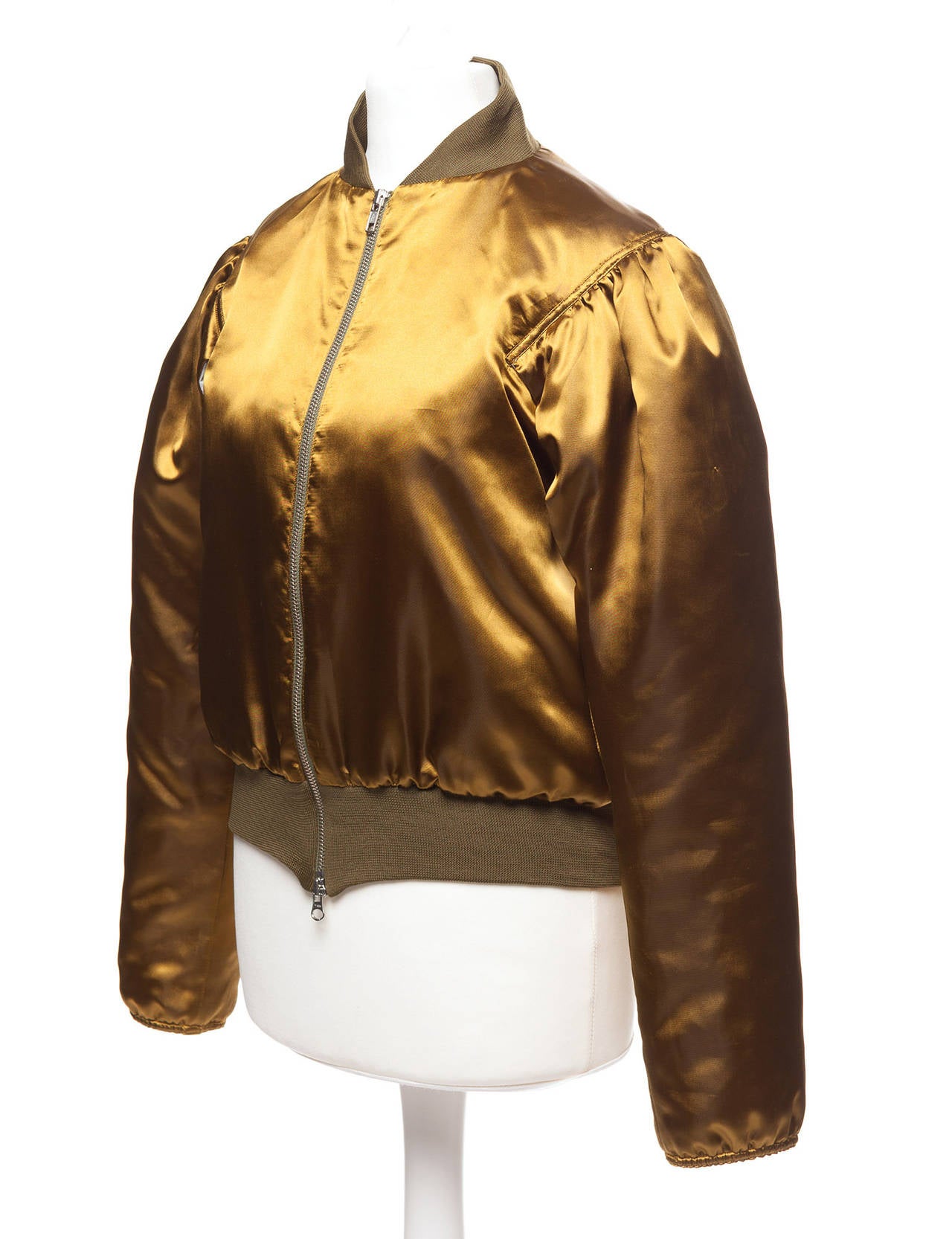 Yohji Yamamoto Vintage Gold Bomber in shiny mustard satin. Bomber has ribbed collar , sleeves and bottom hem detail, 2 way zipper in silver and sheared in sleeves with opening at underarm, snug fit, and off white quiltted linning. Pure romanticism