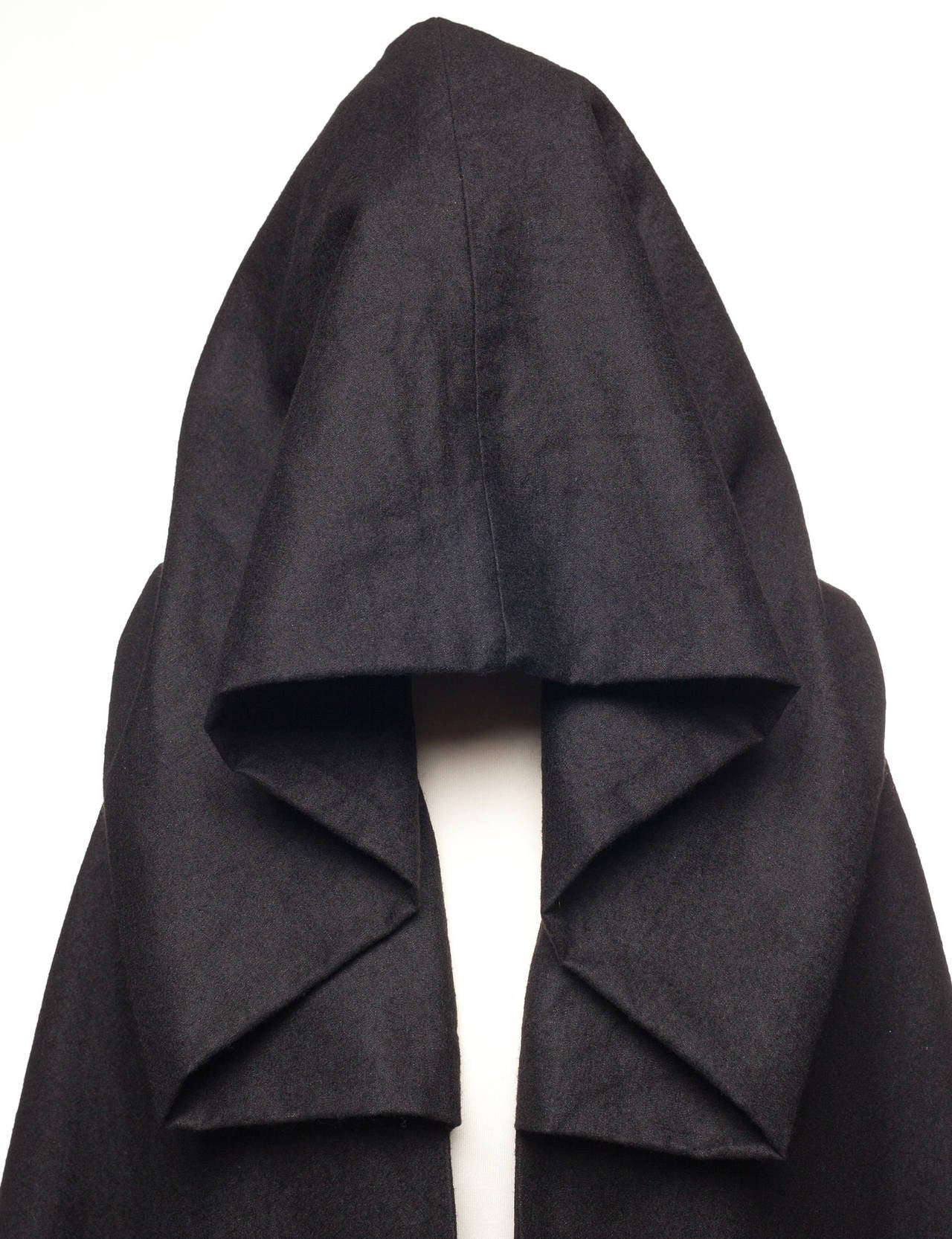 Cape has extra long extensions on both side, 2 arm holes, and oversized hood. It can be worn as a scarf or as a vest. German size 38, US 10.