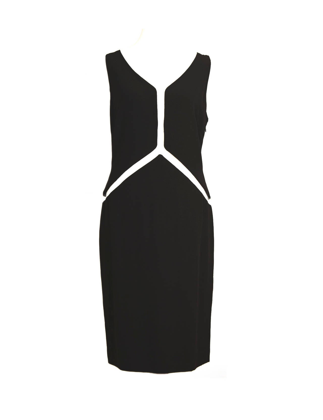 Rare Vintage 80‘s Sybilla pour Gibo dress with stunning cut-out details. Dress is in black viscose and has tiny clear plastic inserts to give dress floating effect, style of dress is 1950's modern classic. Sybilla is an important spanish designer