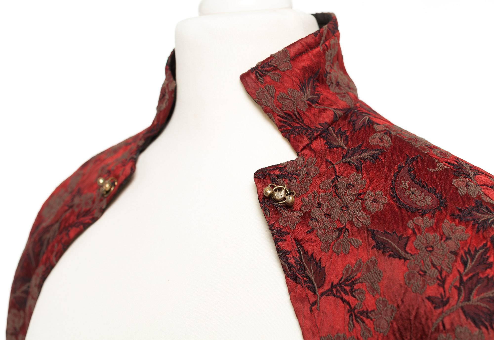 Bolero comes in a rich Bordeaux Brocade, cut empire style, extra long fitted sleeves with kissing front closure. Vintage Dries Van Noten at his best.