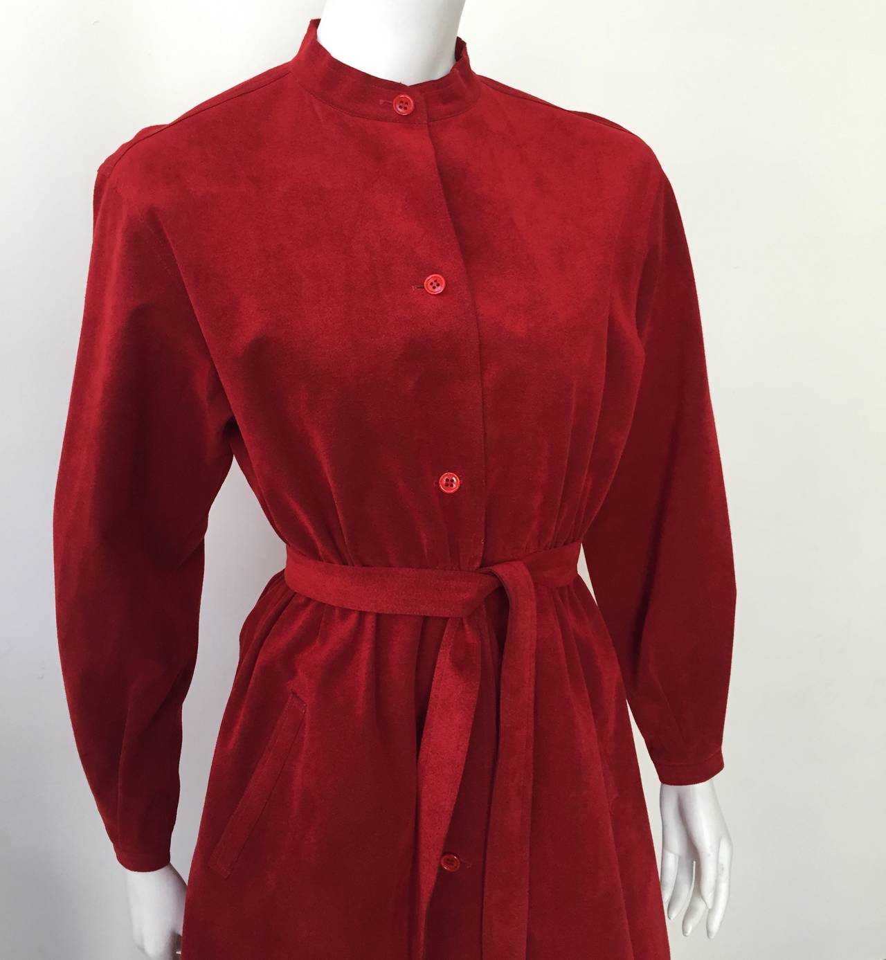 Halston 1970s dark red ultra suede button up dress with pockets and belt. Elastic waistband that easily fits a woman size 4-6 but please see measurements I will provide you so you make sure this dress fits you to perfection. 
Wear as a dress or coat