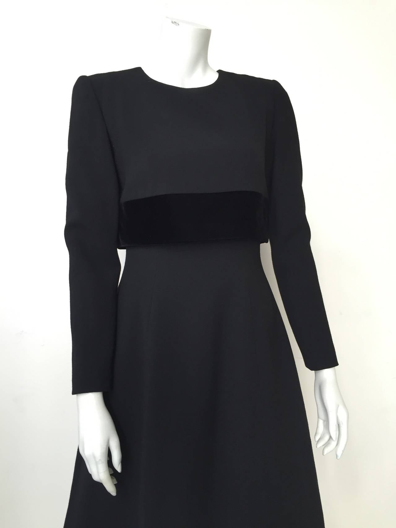 Oscar de la Renta 90s Pink Label black wool with velvet trim and buttons made in the USA and size 6 (please use measurements I provide to measure yourself and make sure this item will fit you to perfection).  The mannequin is a size 4 and this dress