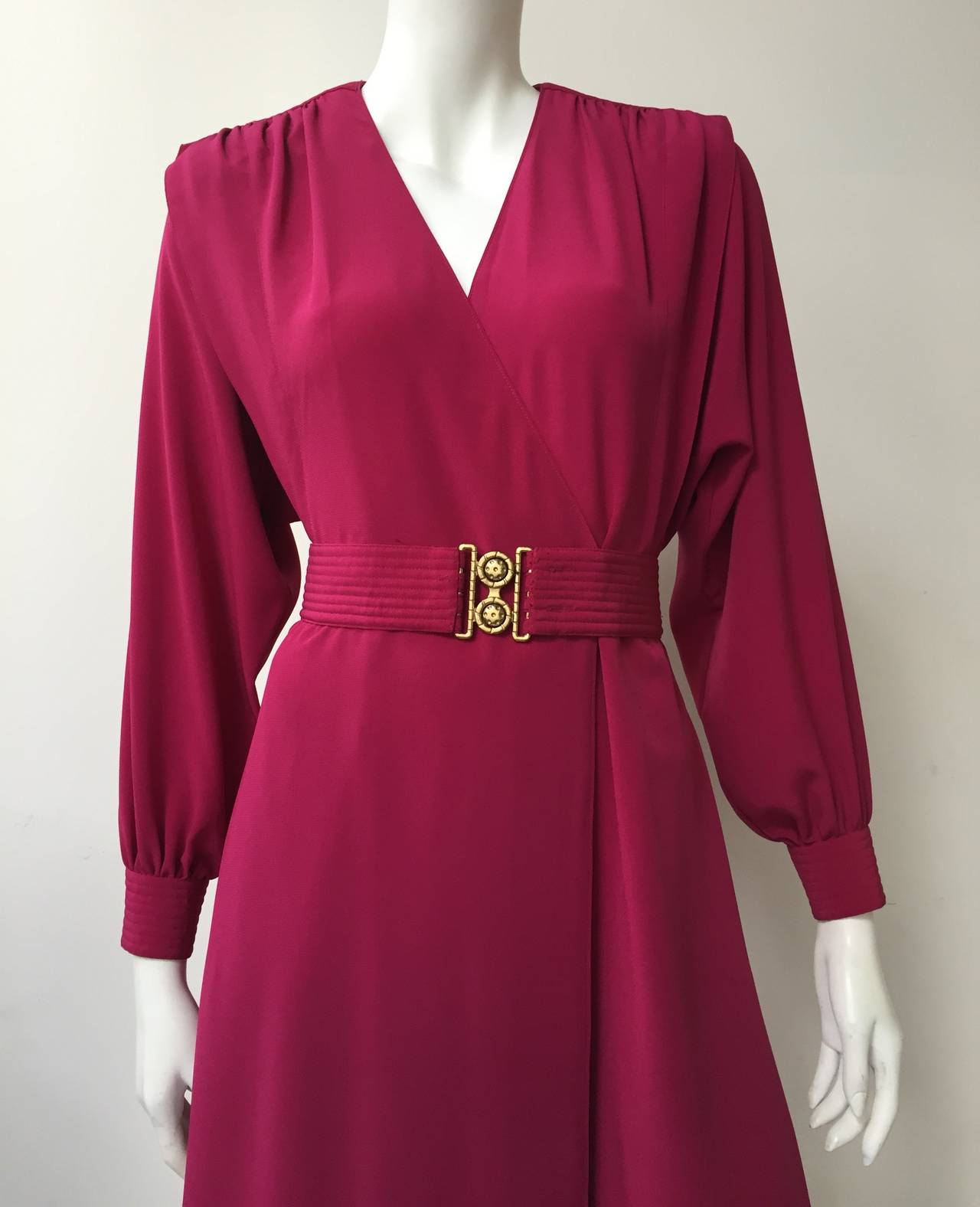 Pierre Cardin for Lillie Rubin 80s burgundy wrap dress with pockets & belt.
Original size tag shows size 4 but this is more size 6 due to how it fits the size 4 mannequin and measurements.
Back part of dress has elastic waistband giving a little