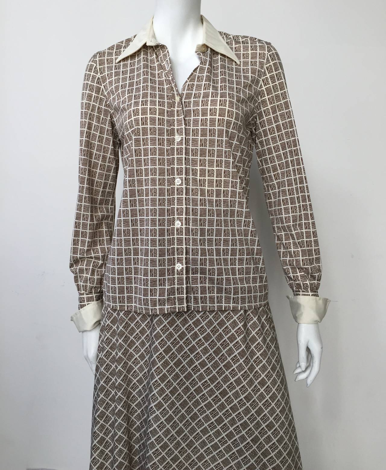 Nina Ricci 1970s Week-End logo 2 piece blouse & skirt set. Ladies please grab your tape measure so you can measure your bust, waist, hips and sleeves to see if this lovely timeless set will fit your body to perfection. 
Size medium made in