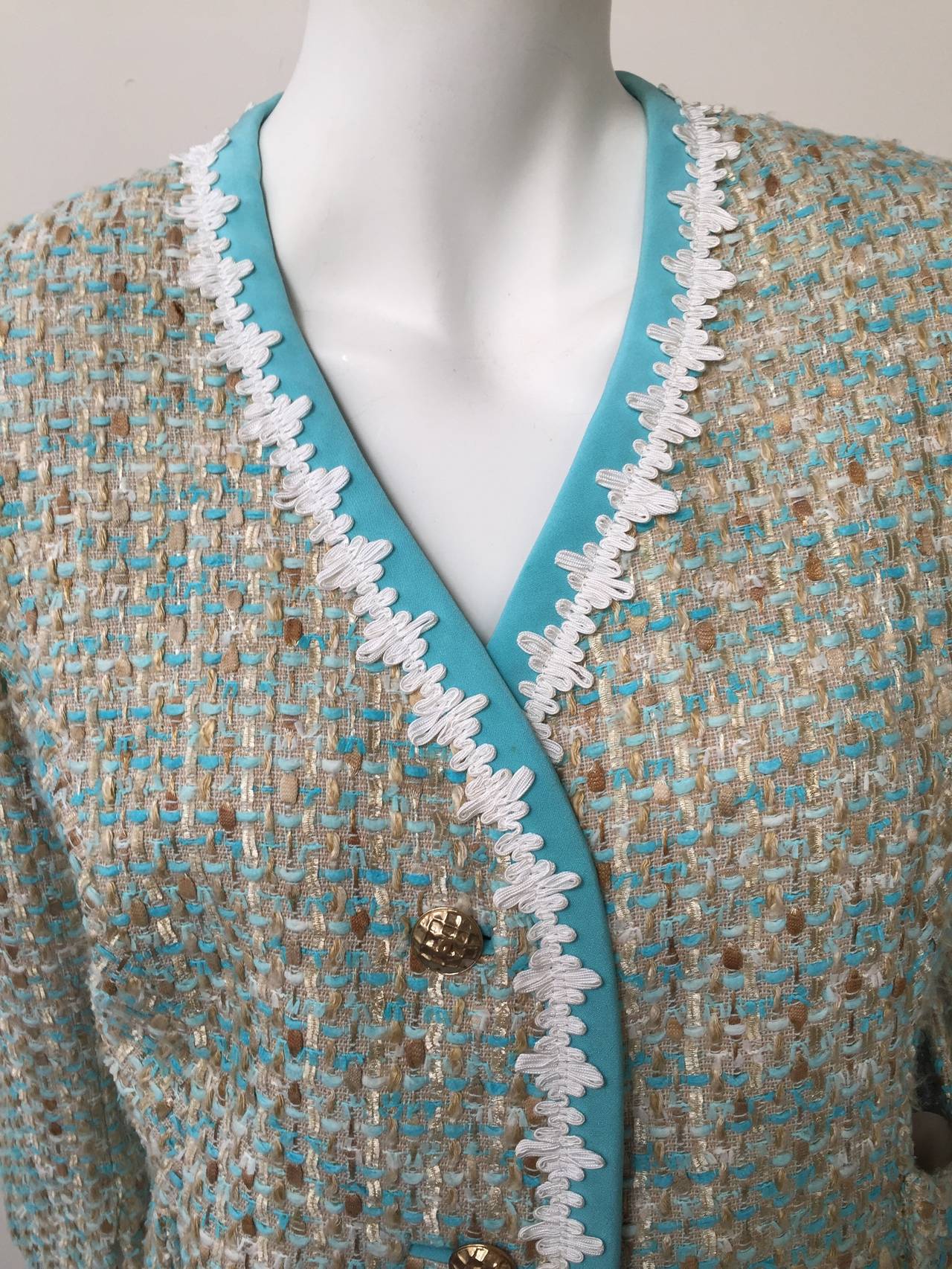 Chanel 1970s sky blue with white trim jacket.  
3 front Chanel logo gold buttons and swoop front pockets. 
Silk lining and in excellent condition.
 Size 38 or size 8 USA but please use measurements provide. 
Measurements are:
40"