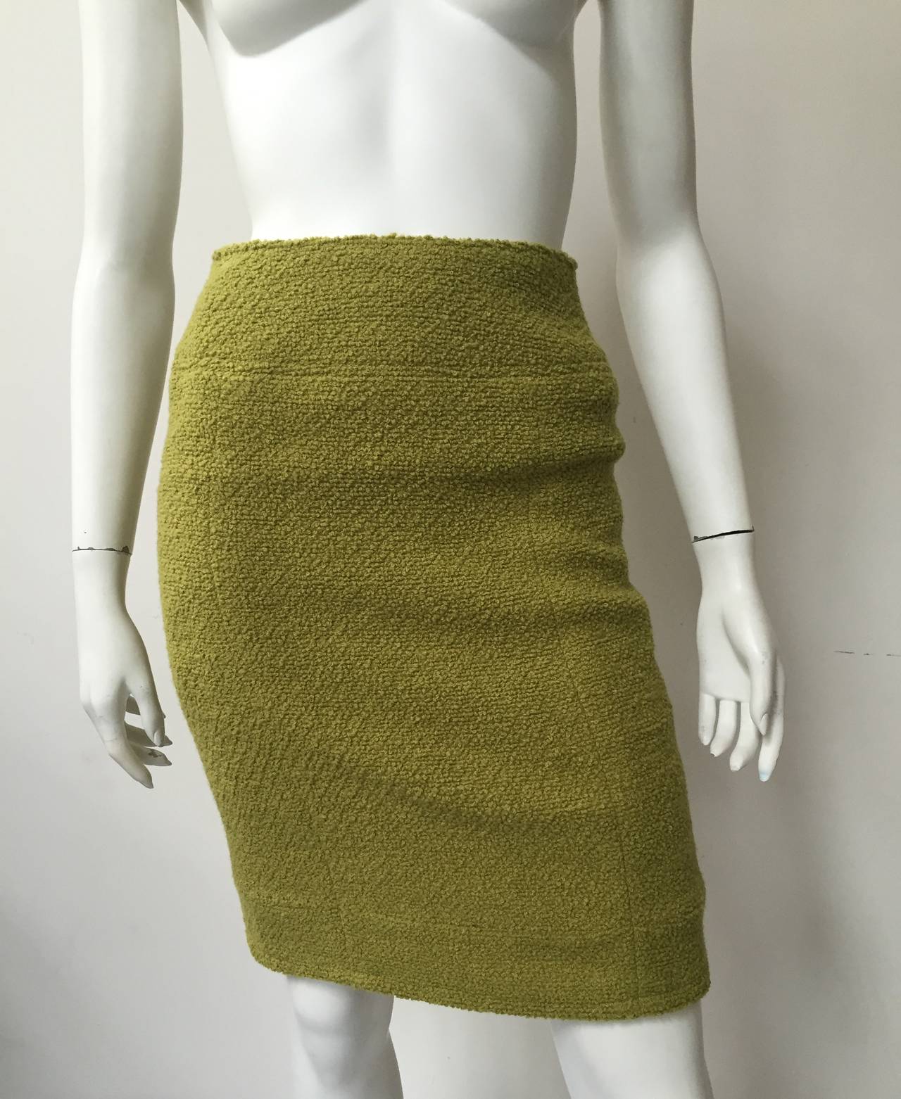 Chanel 80s Boucle wool green pencil skirt made in France size 38 and fits like a modern day size 4. 
Silk lining. 
Please use these measurements below to measure yourself to make sure this will fit you to perfection.
Measurements are:
25