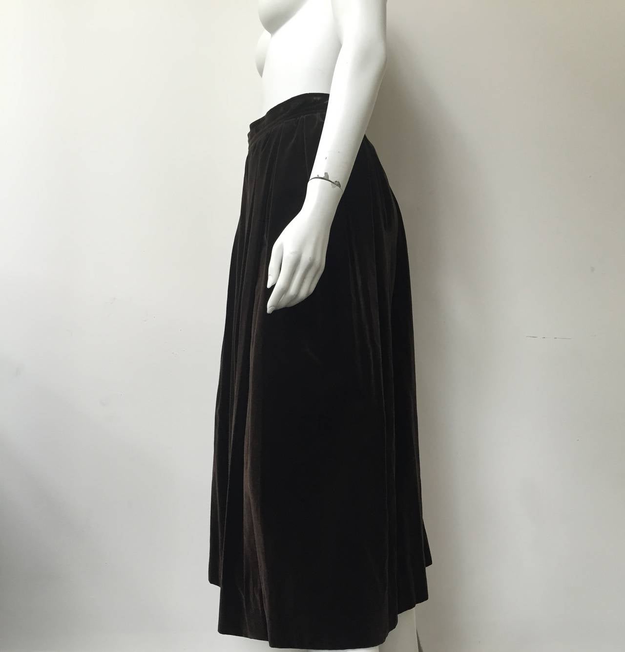 Yves Saint Laurent ~ Saint Laurent Rive Gauche 70s brown thick velvet long pleated skirt with pockets is a vintage size 40 but fits a modern day size 6. 
Please use the measurements I will provide you to measure yourself to make sure this fits you