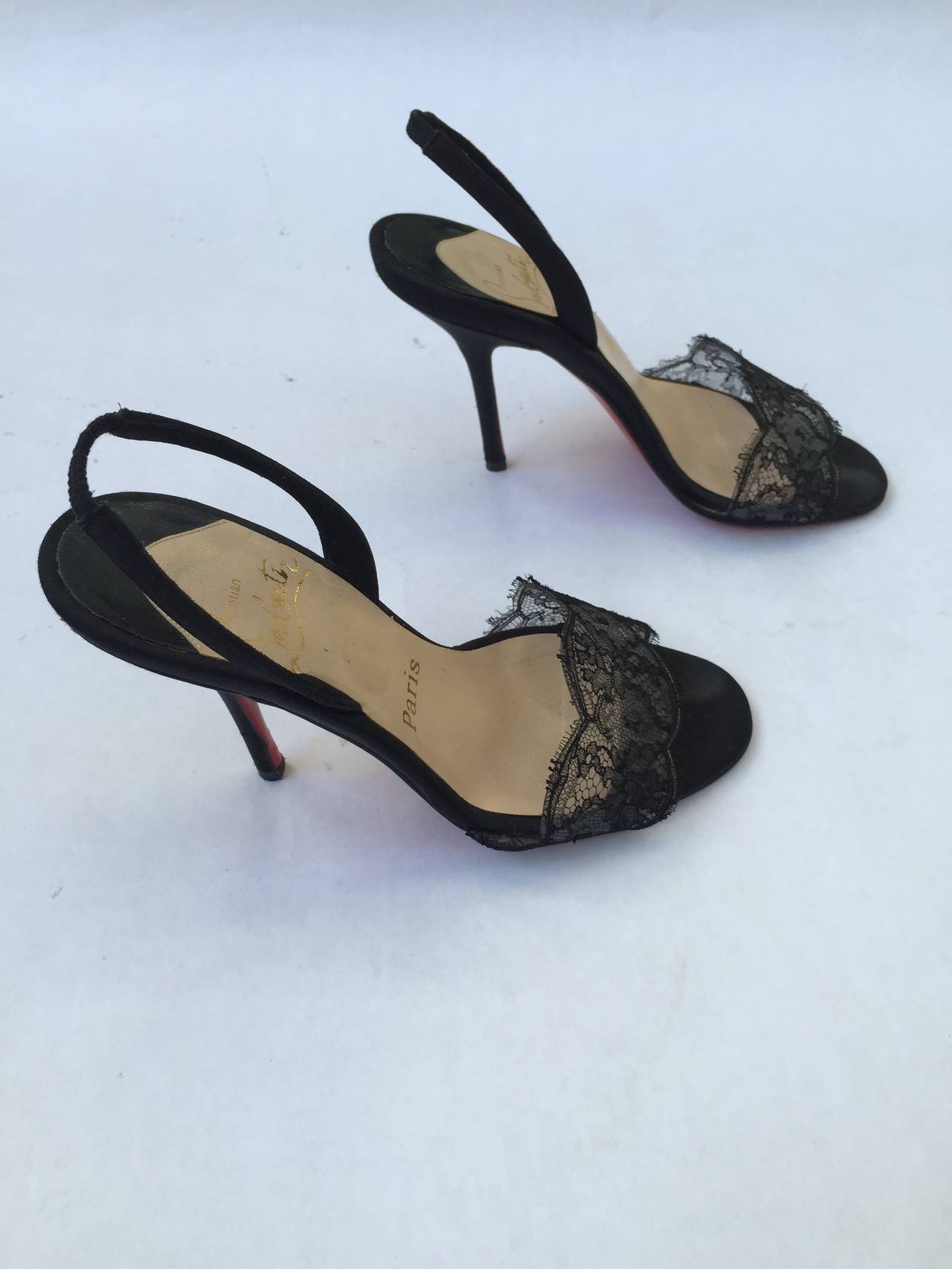 Christian Louboutin black heels with black lace front trim size 35.1/2 made in Italy. Shoe measures 9